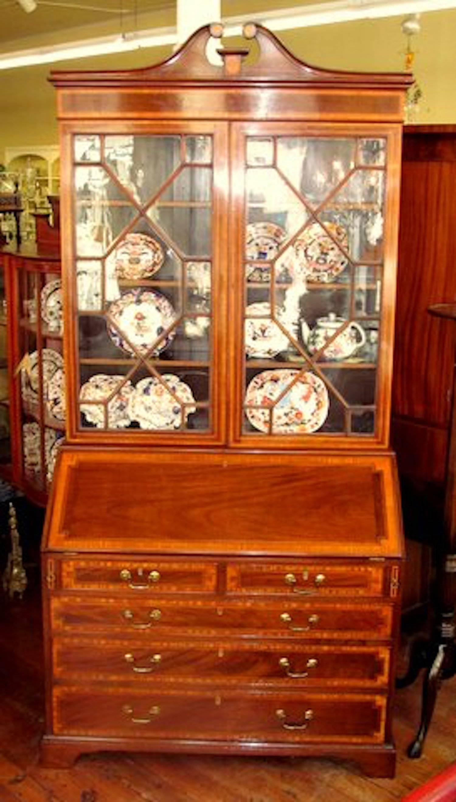 Fabulous quality antique English George IV satinwood inlaid mahogany Chippendale style Bureau Bookcase/Secretary with gorgeous fitted interior having "secret" document slides on either side of the central prospect door. Original swan-neck