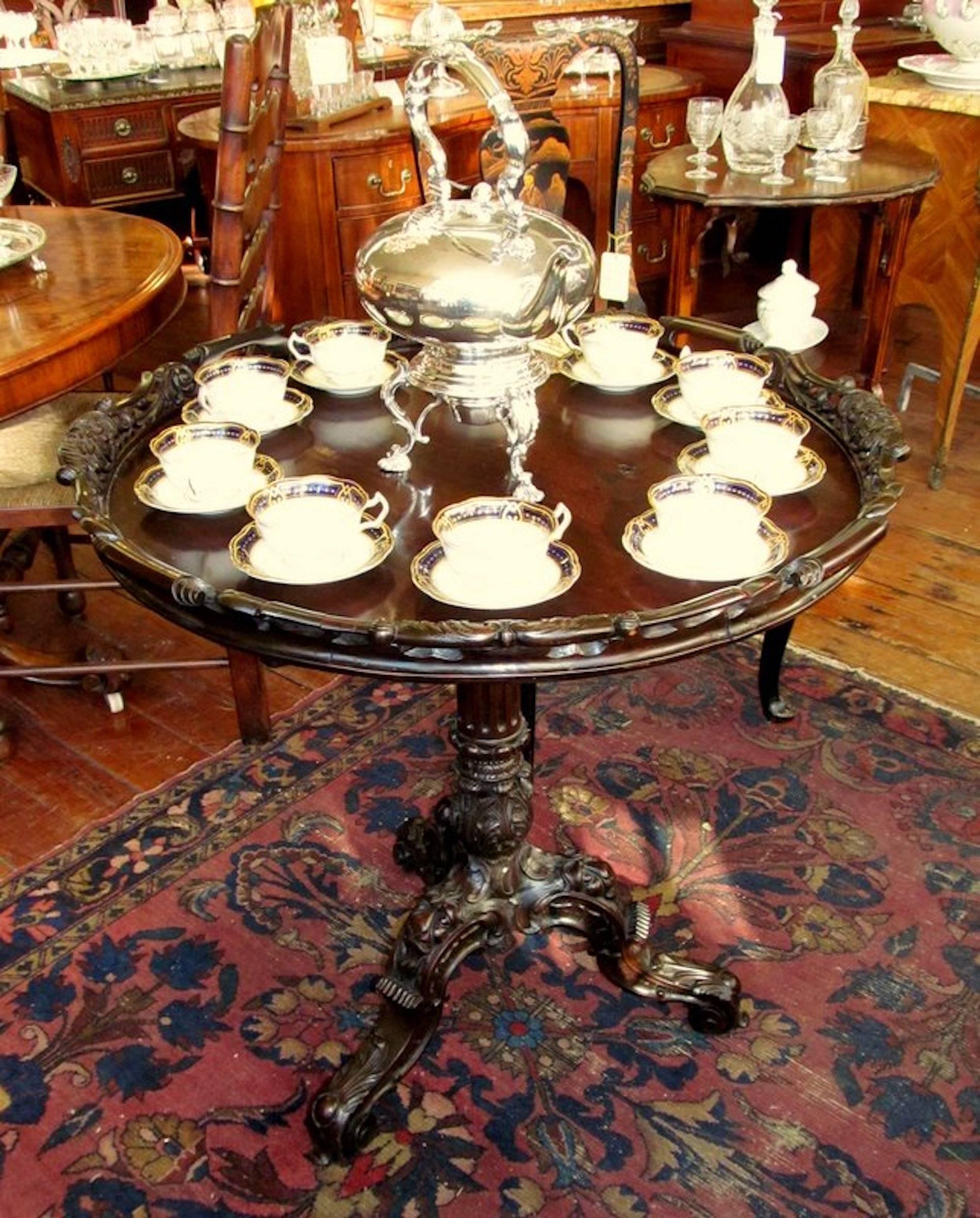 Exceptional quality antique Irish Chippendale style profusely hand-carved solid mahogany tilt-top circular tripod tea table or occasional table

Please note extraordinary profusely carved pedestal evidencing a gorgeous acanthus leaf hand-carved urn