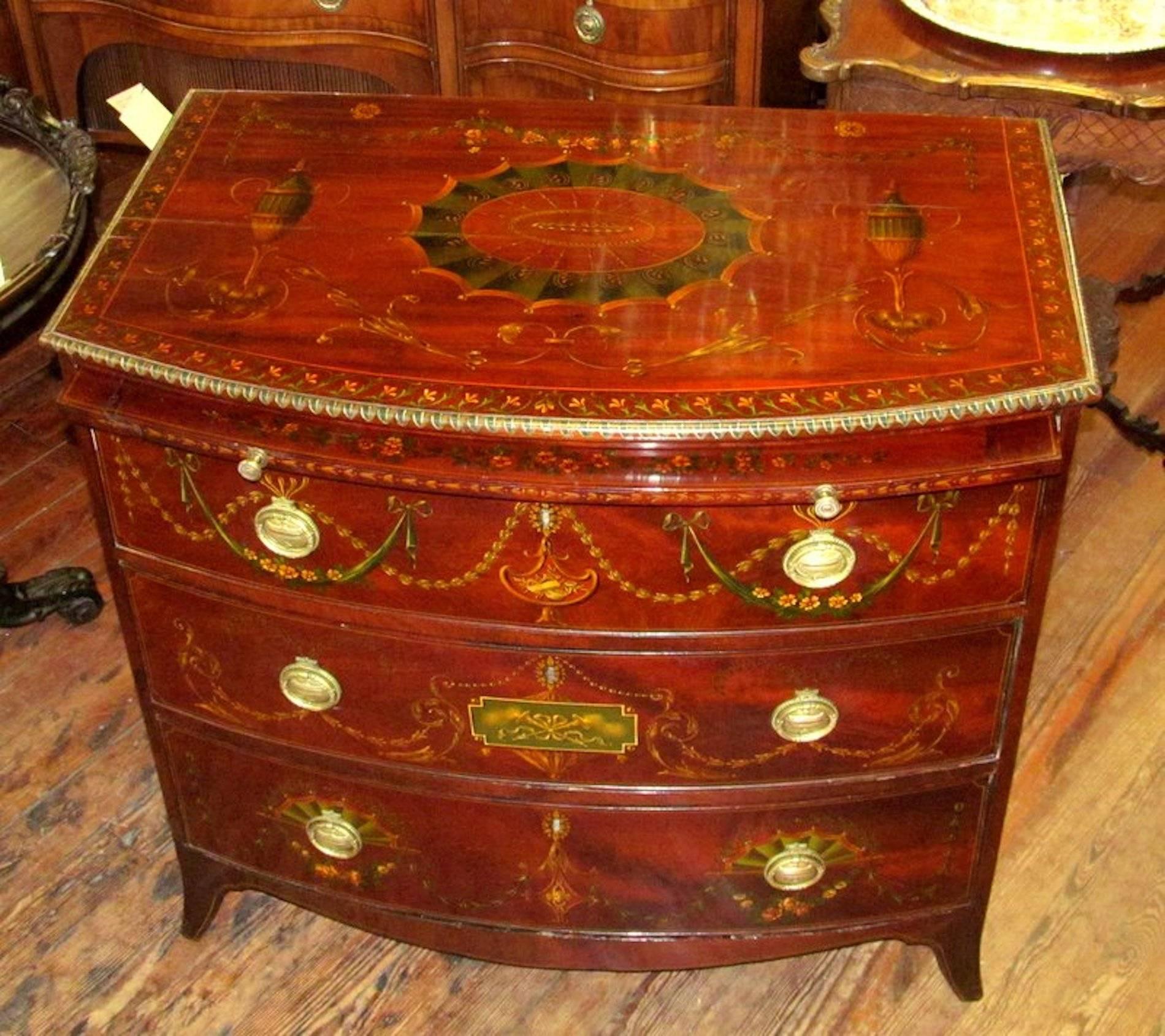 Fabulous and rare antique English George III flame mahogany Bowfront bachelor's chest with rare brushing slide.

Completely and exquisitely hand-painted in an 