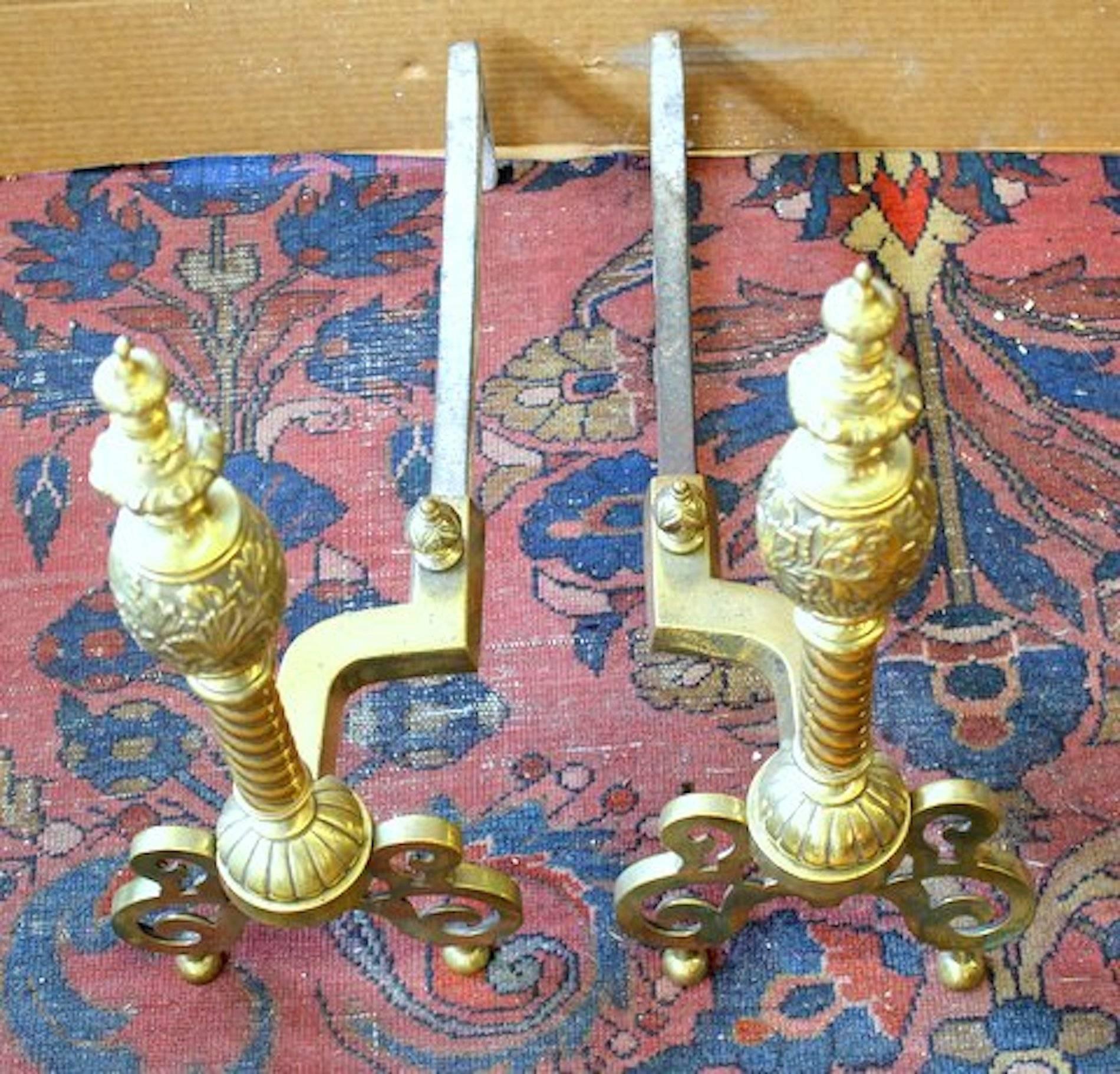 Pair of rare design antique American brass andirons with handsome cast brass lemon-shaped top; spiral column and cast, pierced base.