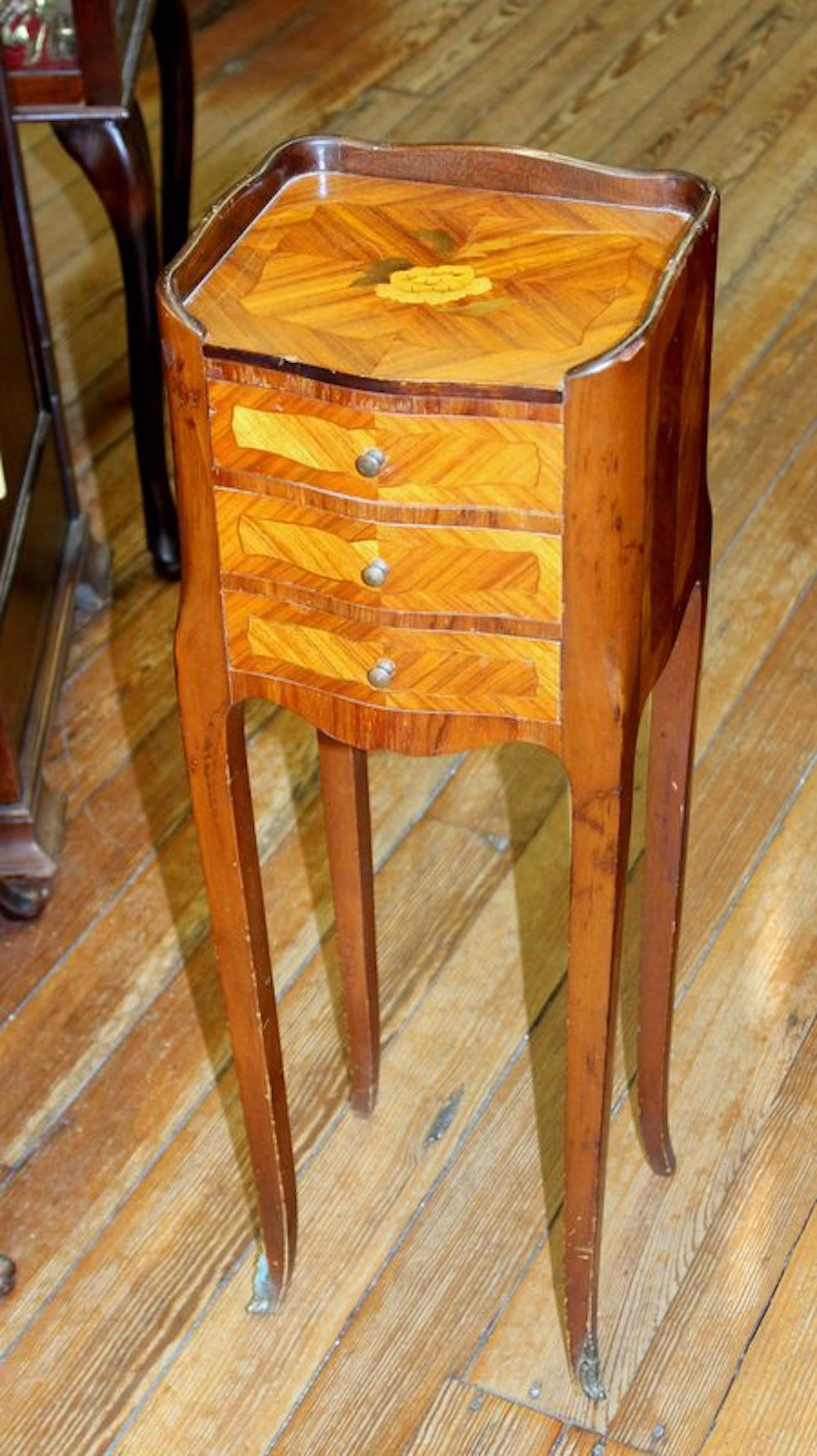 Lovely old French unusually small inlaid Kingwood bedside table with handsome ormolu mounts.