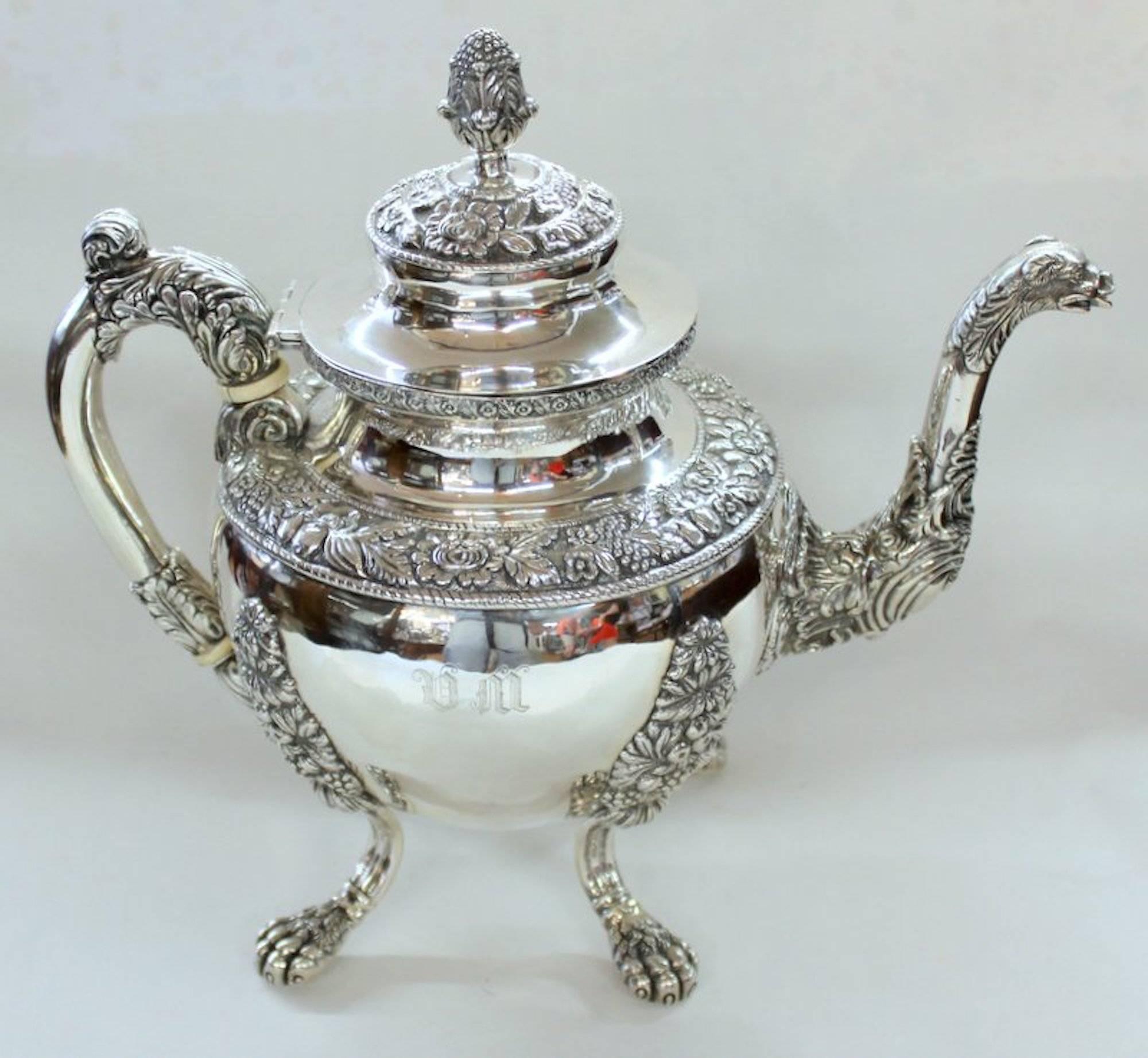 Rare and important antique American extraordinarily heavyweight coin silver (.900 Fine) Rococo style four-piece tea set including exceptional teapot, two handled covered sugar bowl, cream jug and waste bowl.

Maker: Andrew de Milt, New