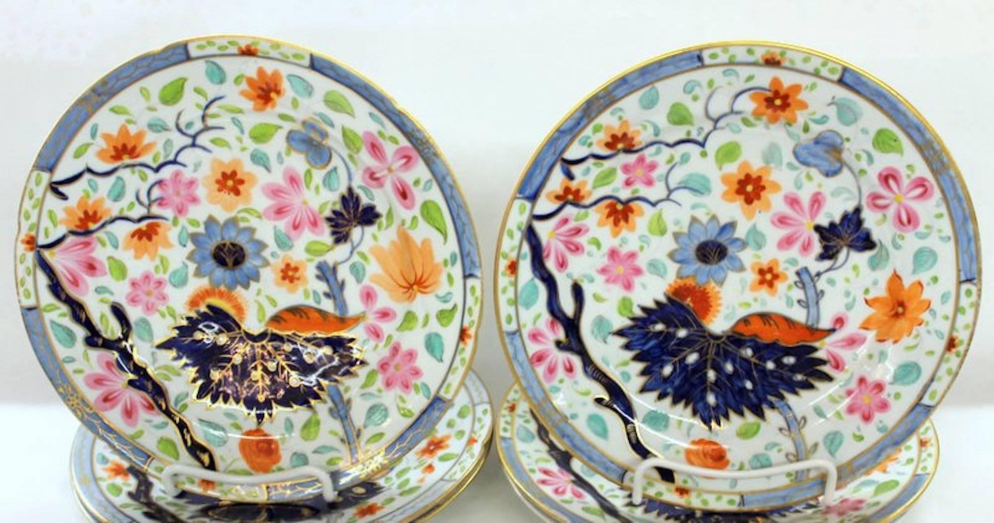 Set of four exceptional antique English hand-painted porcelain luncheon/dessert plates in the banana leaf pattern with superbly hand-painted flowers and leaves overall.

Attributed to Coalport (One plate very lightly crazed).
 