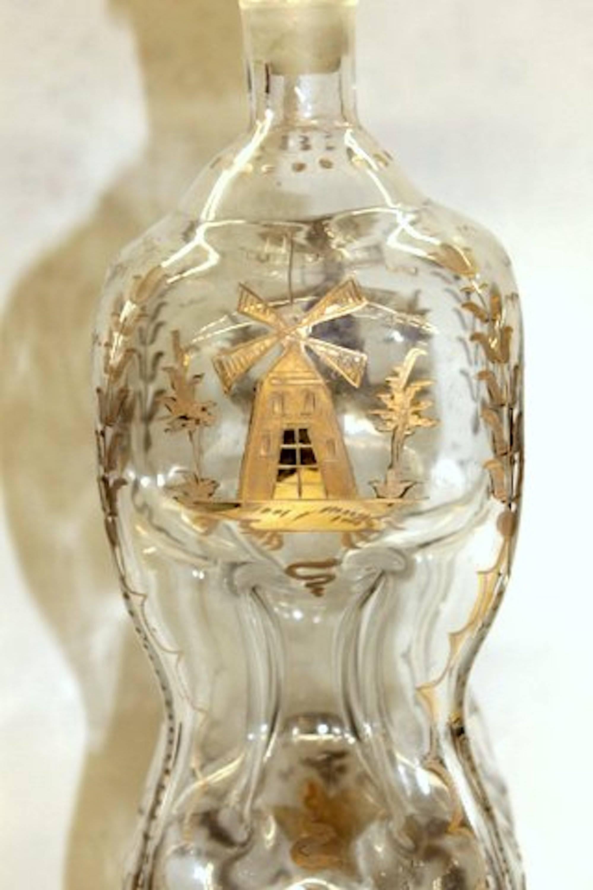 Exceedingly rare and fine antique Dutch engraved and gilt mouth blown glass kuttrolf or kluk-kluk decanter

Please note lovely engraved and gilt Dutch sailing and windmill scenes.
No. 2 engraved on base. Lovely, original stopper. All pristine (no