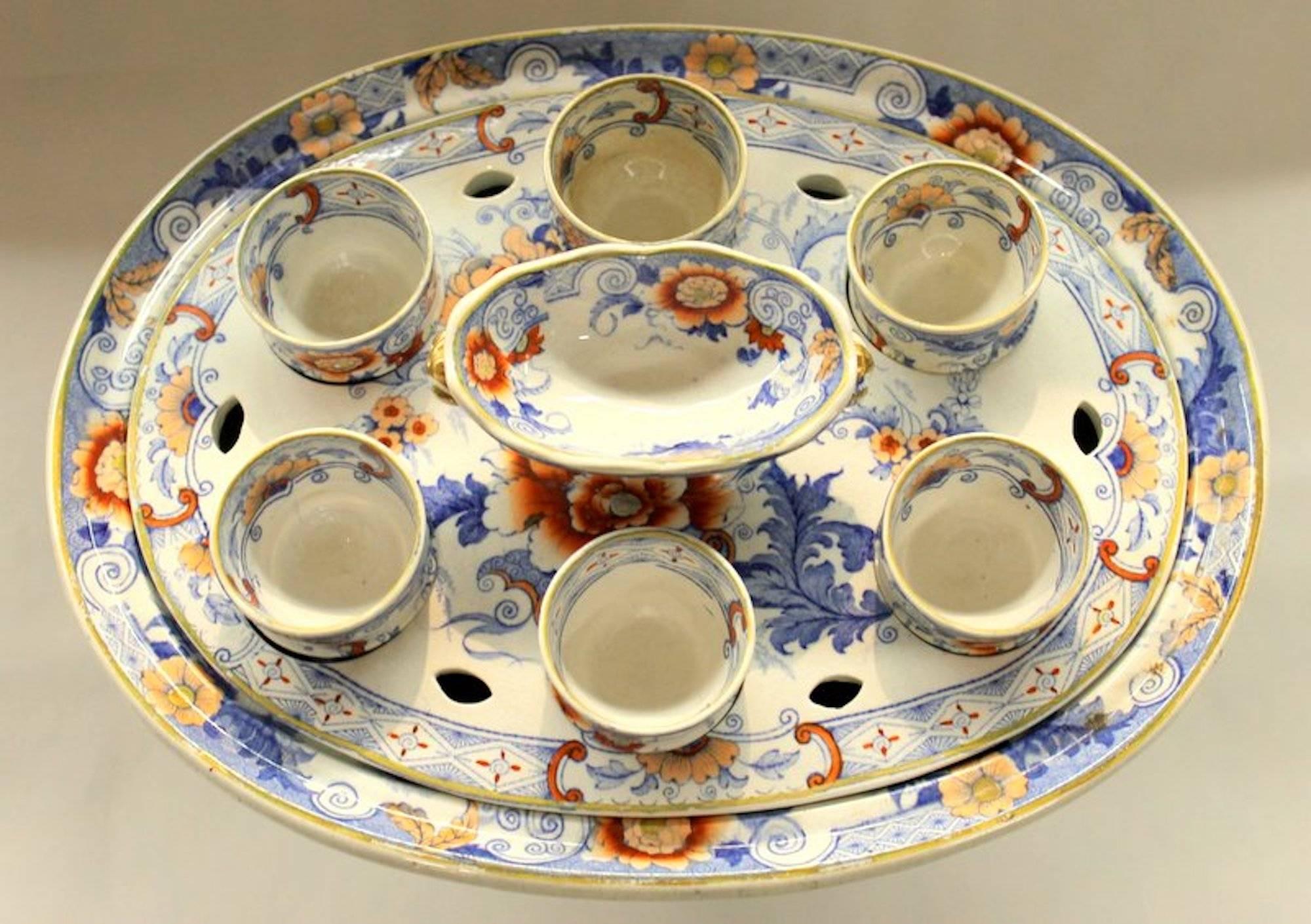 Fabulous quality rare and important antique English earthenware or ironstone Imari decor six cup egg cruet on stand

All parts are original

There is some brown crazing to two of the cups otherwise the condition is nearly pristine. Please also