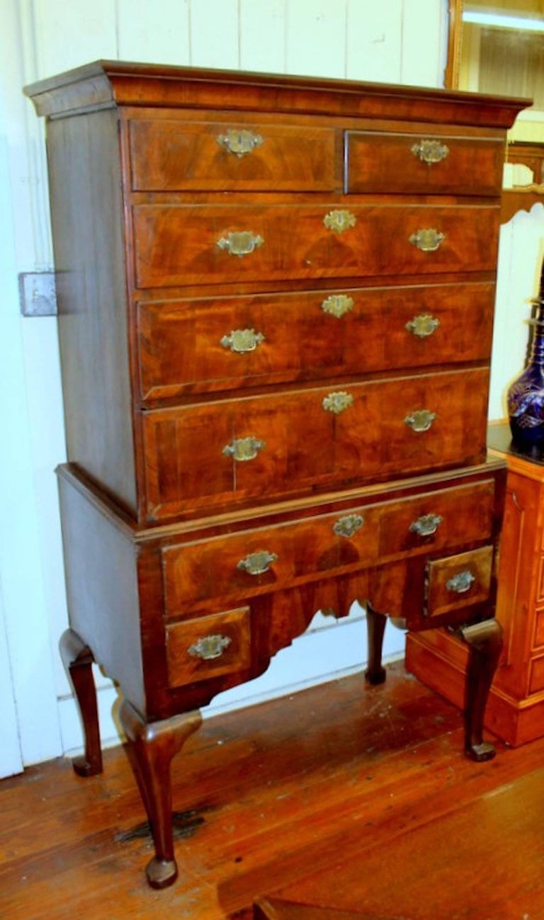 Very fine and rare antique English George II/III inlaid burr walnut Queen Anne style chest on stand on highboy. Note oak-lined drawers. 

Please note handsome cross-banded drawer fronts, cabriole legs on pad feet and original engraved brasses.

