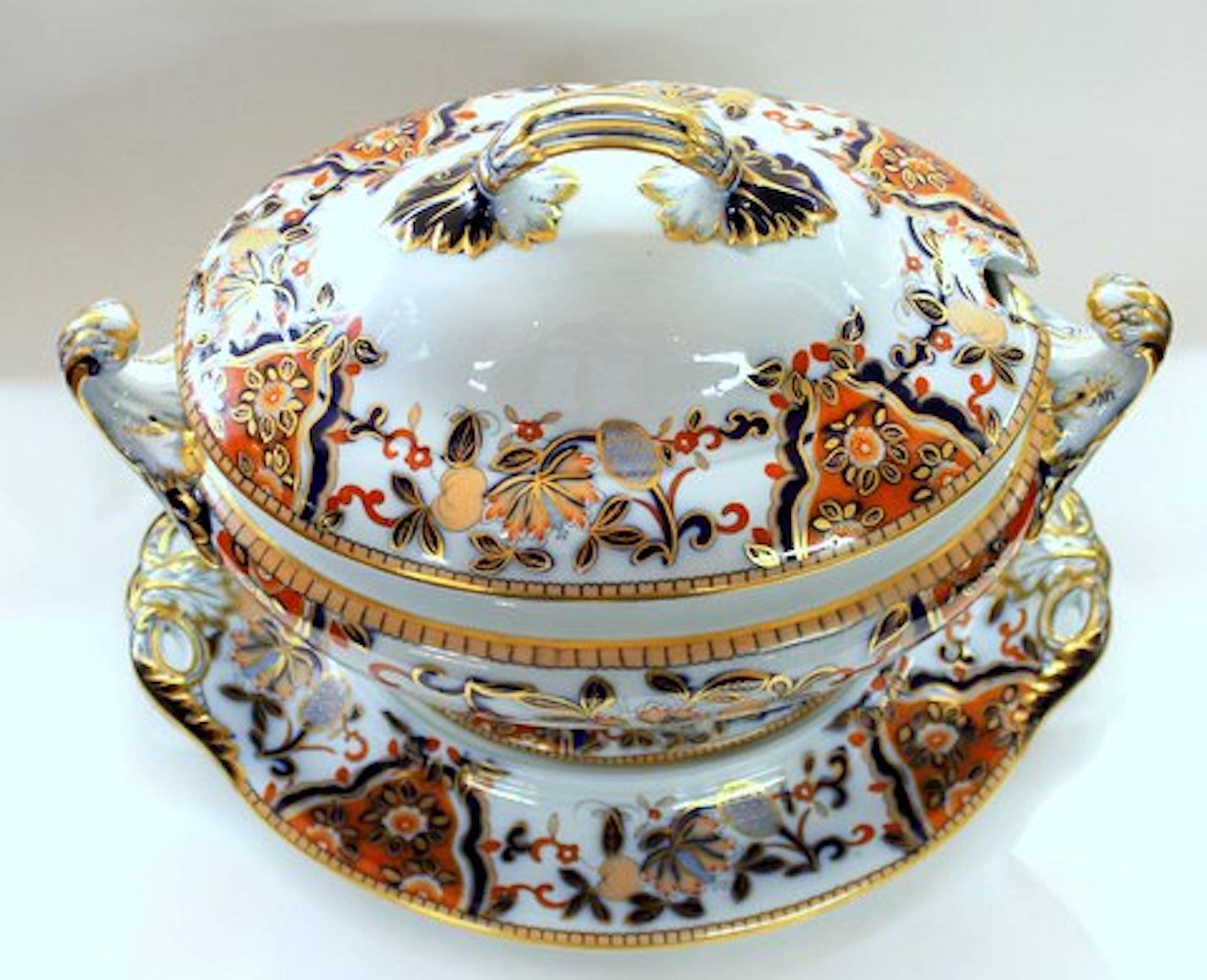 Exceptional quality antique English Davenport ironstone hand decorated Imari large soup tureen and stand with rare printed mark, circa 1840-1860. This tureen appears to have been kept as a cabinet piece only and is in pristine condition showing no