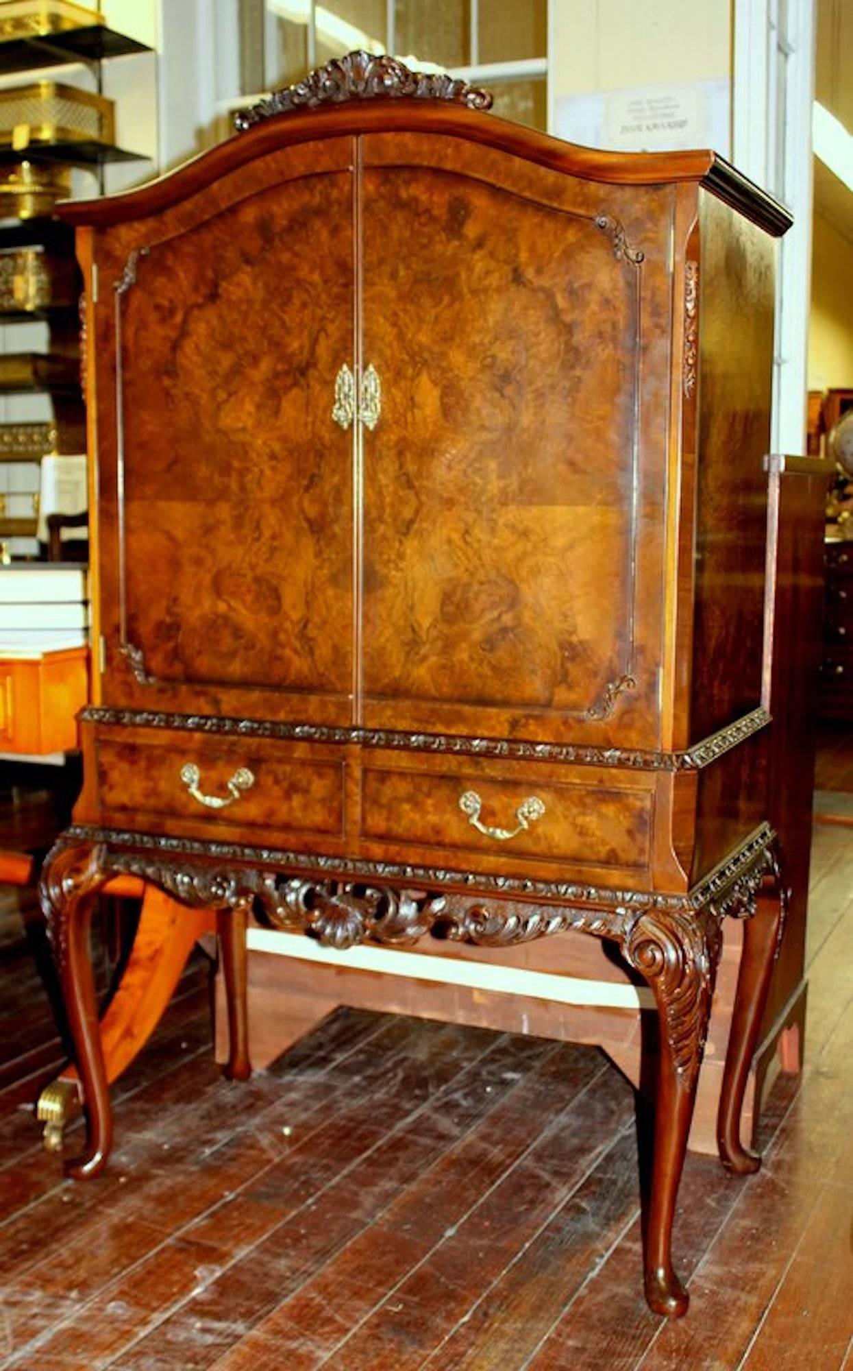Extraordinary quality Old English bookmatched burr walnut and hand-carved Georgian style drinks cabinet

