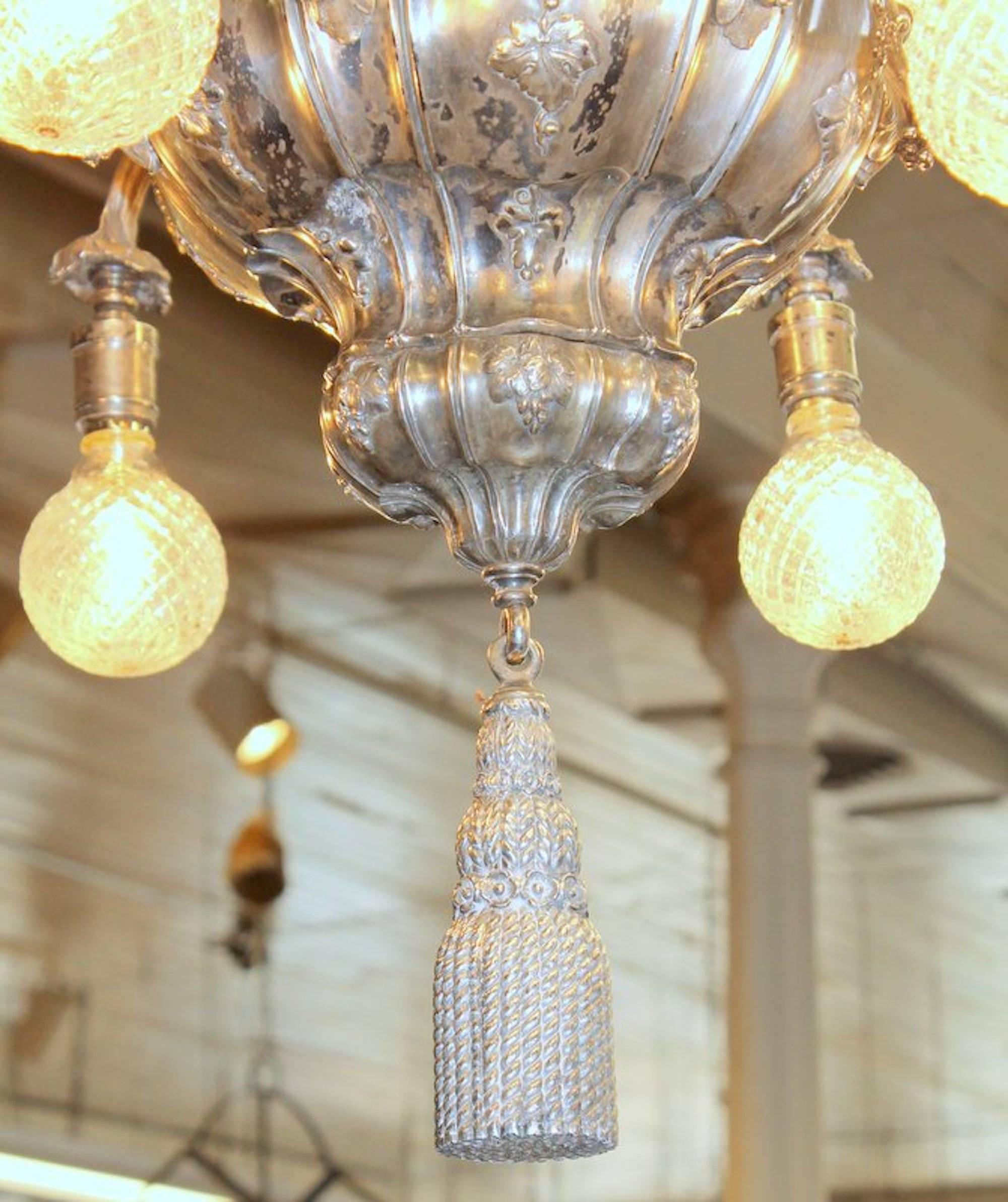 Very fine and rare antique American E. F. Caldwell & Co. Silver plated bronze nine-light, two tier pear shape, grape motif chandelier with cast tassel and original canopy and chain

Edward F Caldwell & Co. was a premier designer and manufacturer