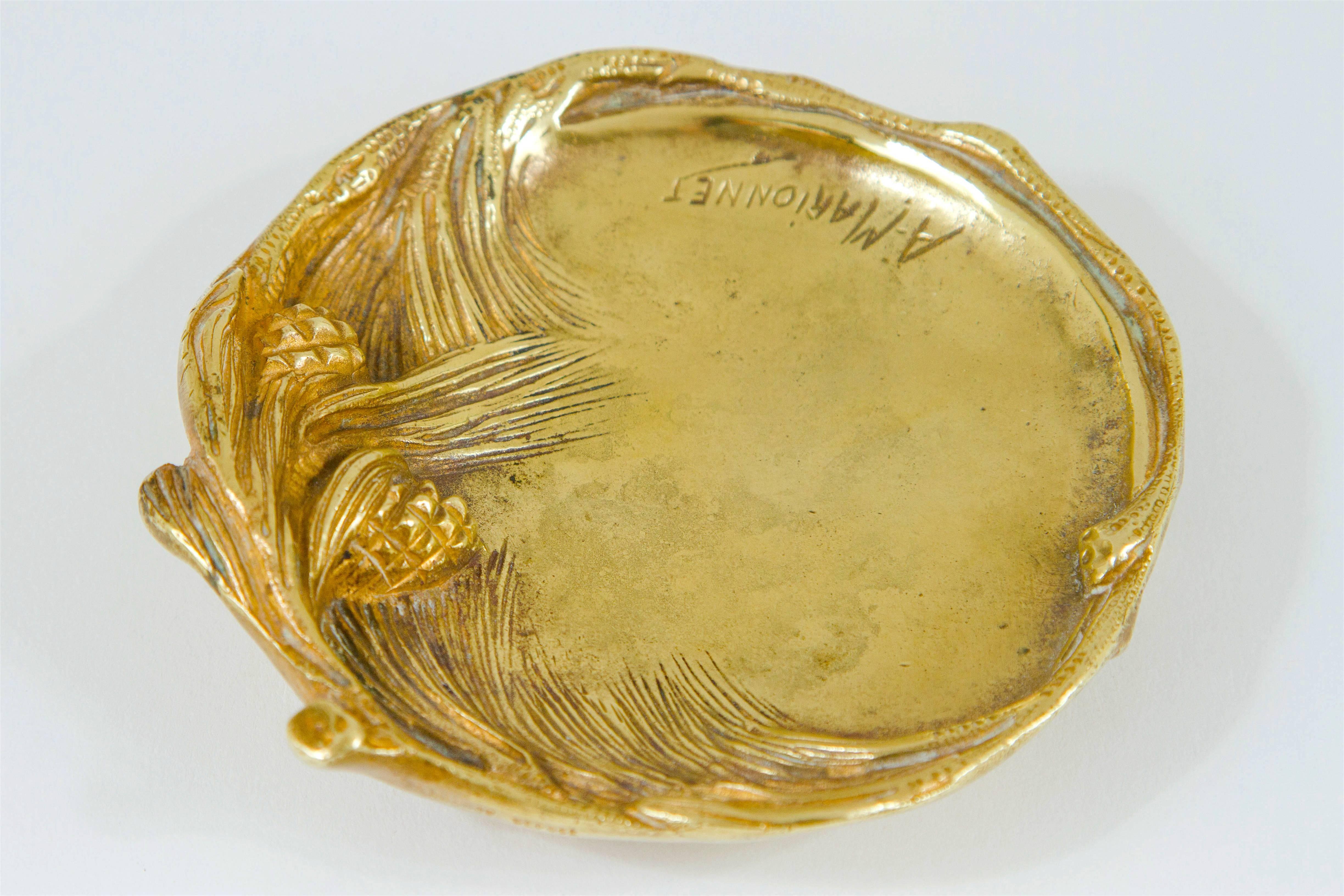 A lovely late 19th-early 20th century antique vide poche (translates to empty pockets for keys, change, etc.) in gilt bronze by French artist and sculptor Albert Marionnet (1852-1910). Resting on four feet, the dish is encircled by detailed natural
