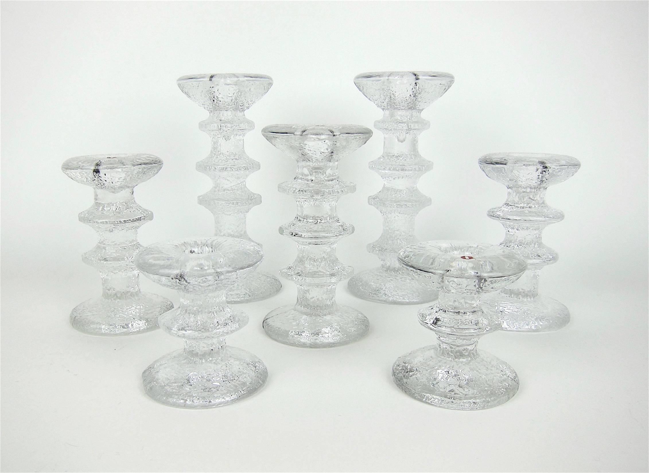 An elegant collection of seven Scandinavian modern vintage candlesticks designed by Timo Sarpaneva for Iittala of Finland in 1966. The 