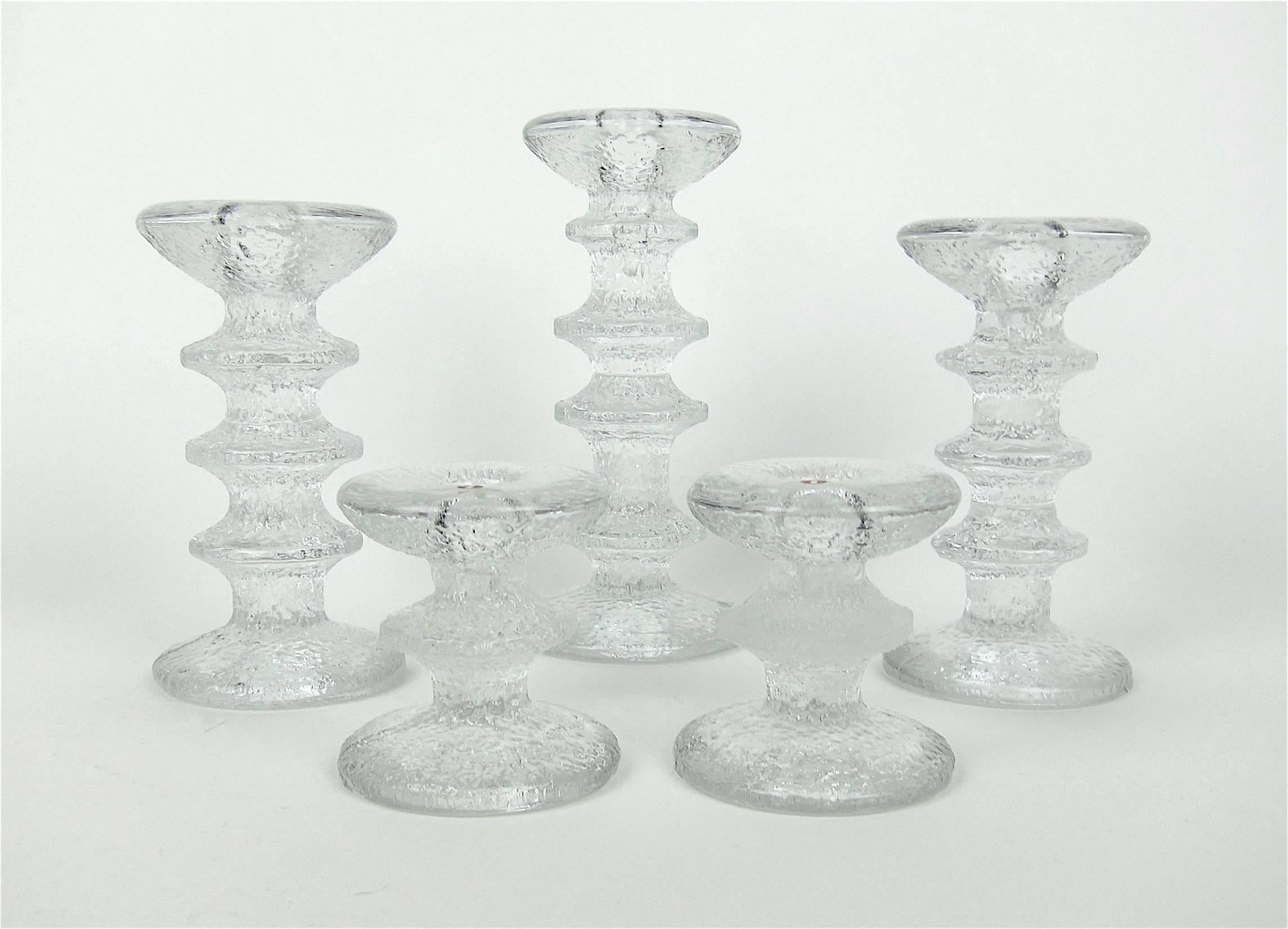 An elegant collection of five Scandinavian modern vintage candlesticks designed by Timo Sarpaneva for Iittala of Finland in 1966. The 