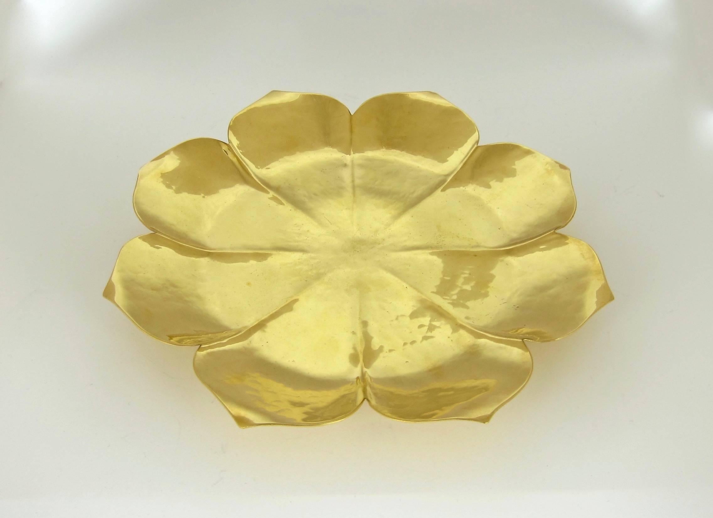 An Art Deco-era gilt lotus flower form dish on a ring foot by Marie Zimmermann (1879-1972). The design is an abstracted lotus blossom composed of eight petals with pointed tips and comes directly from the artist's estate.

The substantial art metal