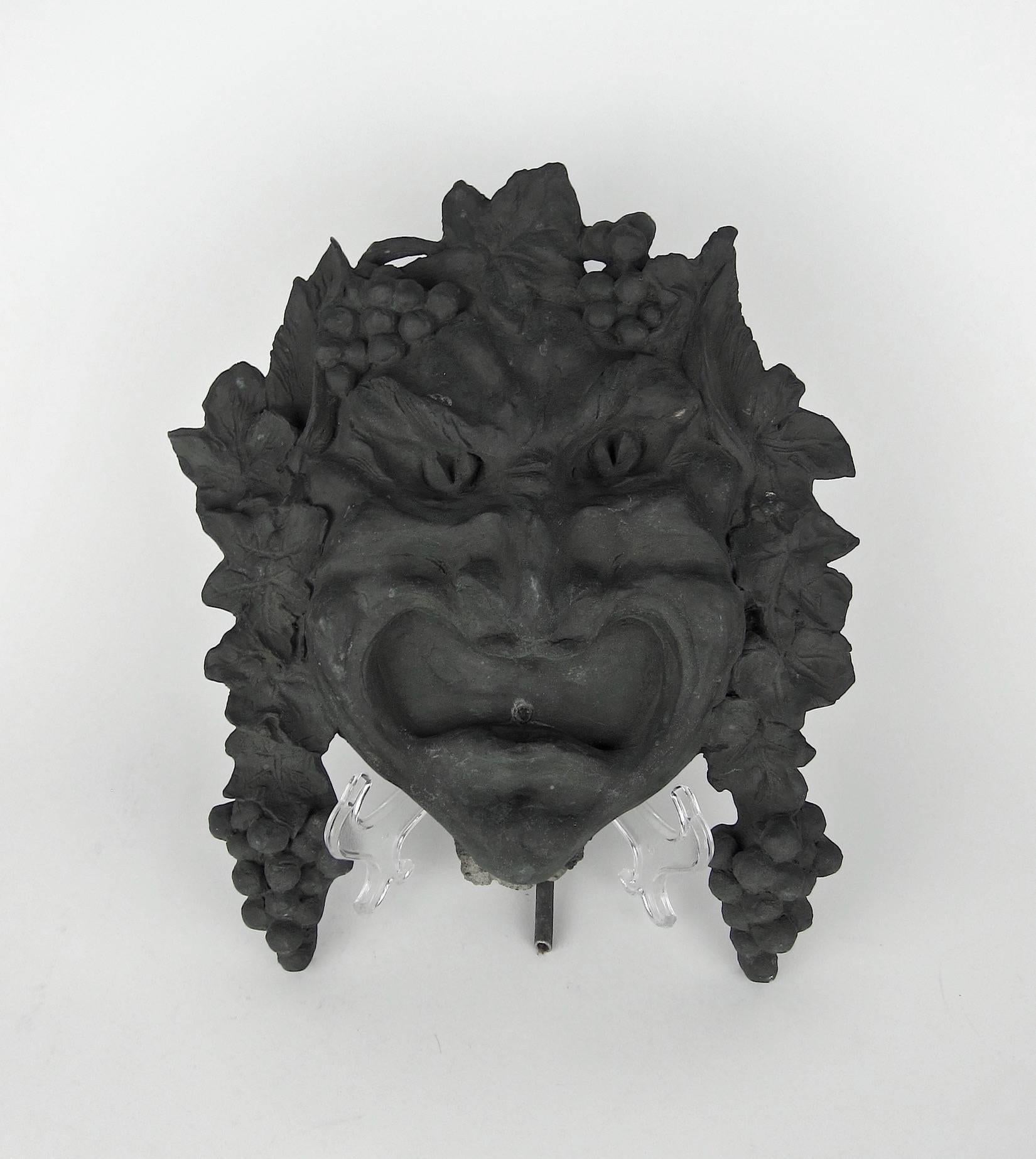 A striking Bacchanalian fountain head / wall sculpture in heavy bronze designed in Classical Roman style by noted American metalsmith and jeweler Marie Zimmermann (1879-1972) and cast by Roman Bronze works of Greenpoint, Brooklyn, circa 1915. The