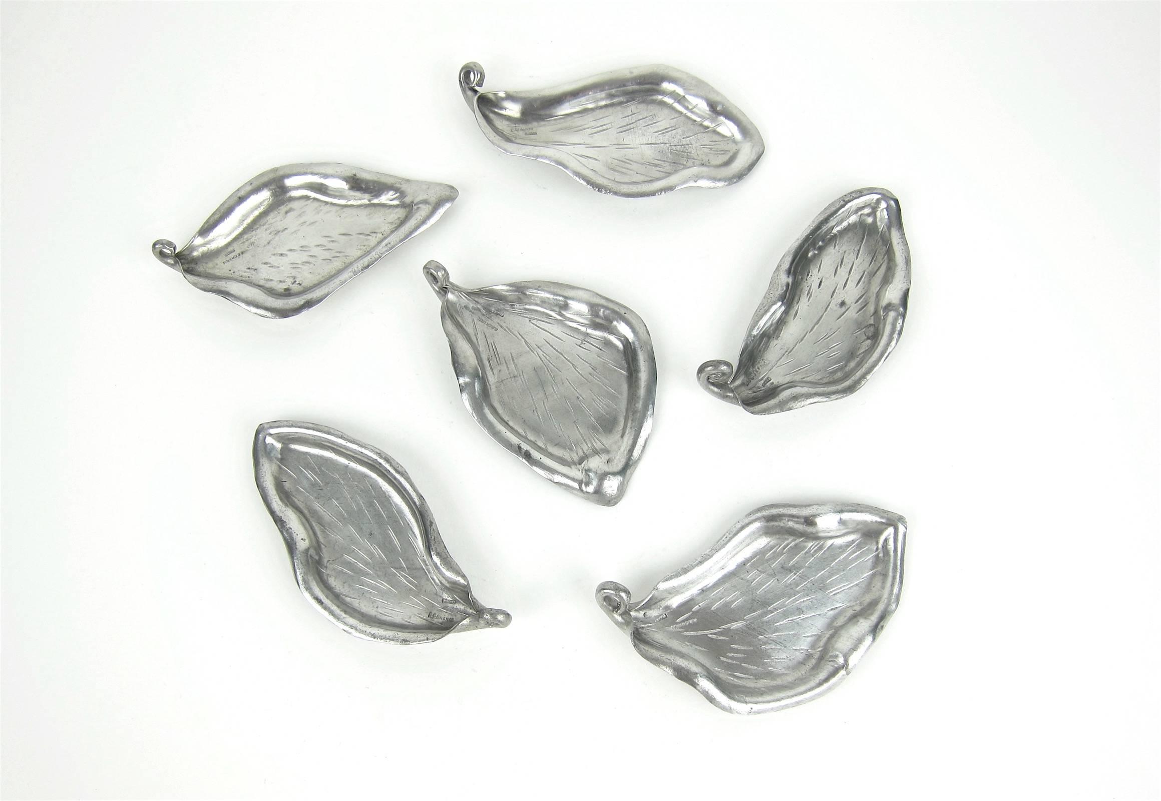 An exquisite set of six French Art Nouveau pewter leaf dishes by renowned Parisian sculptors Alice Chanal (1872-1951) and Eugene Louis Chanal (1872-1925.)

Each hand-crafted leaf exhibits the fluid lines and form typical of the Art Nouveau era with