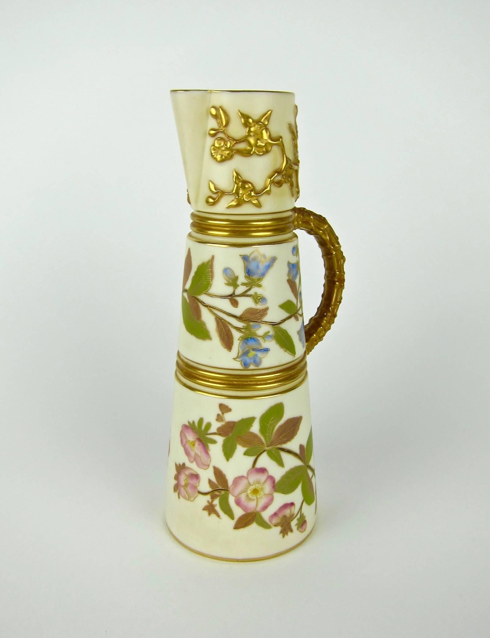 A fine late 19th century ivory porcelain ewer by Royal Worcester of England, date marked for 1884. This exquisite antique pitcher is decorated with hand-painted Japanese floral motifs characteristic of Aesthetic Movement and Victorian era ornament