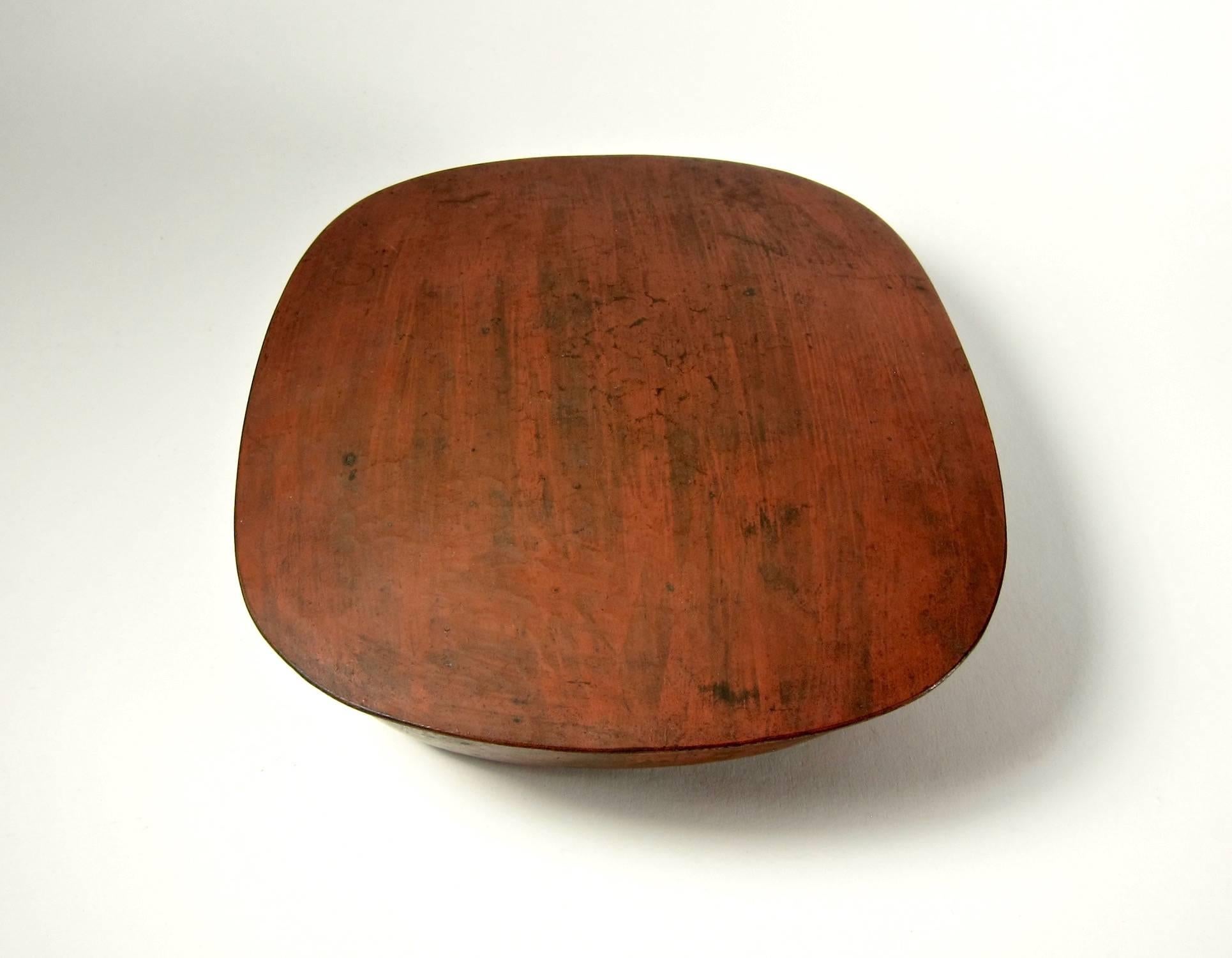 An Antique American covered box of bronze or copper finished with a distinctive red patina by American metalsmith Marie Zimmermann (1879-1972). The box comes directly from the artist's estate and dates to the Arts & Crafts period, circa 1915, while