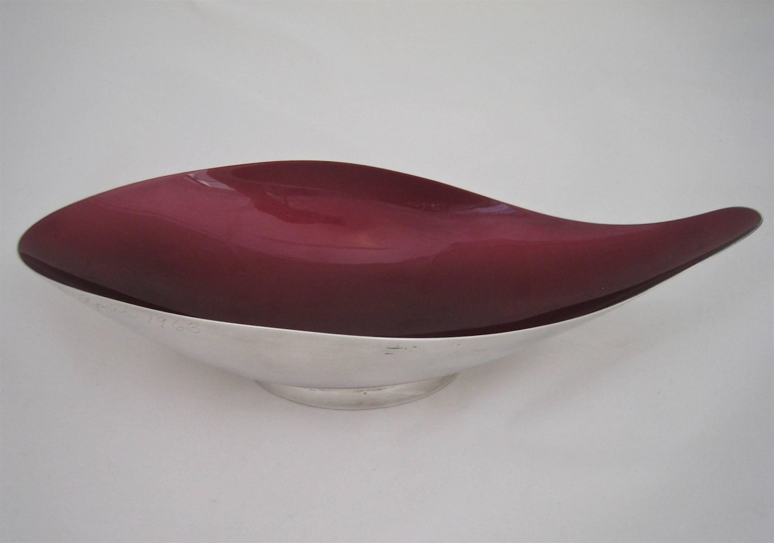 A large Mid-Century biomorphic-shaped presentation bowl in deep, ruby red 