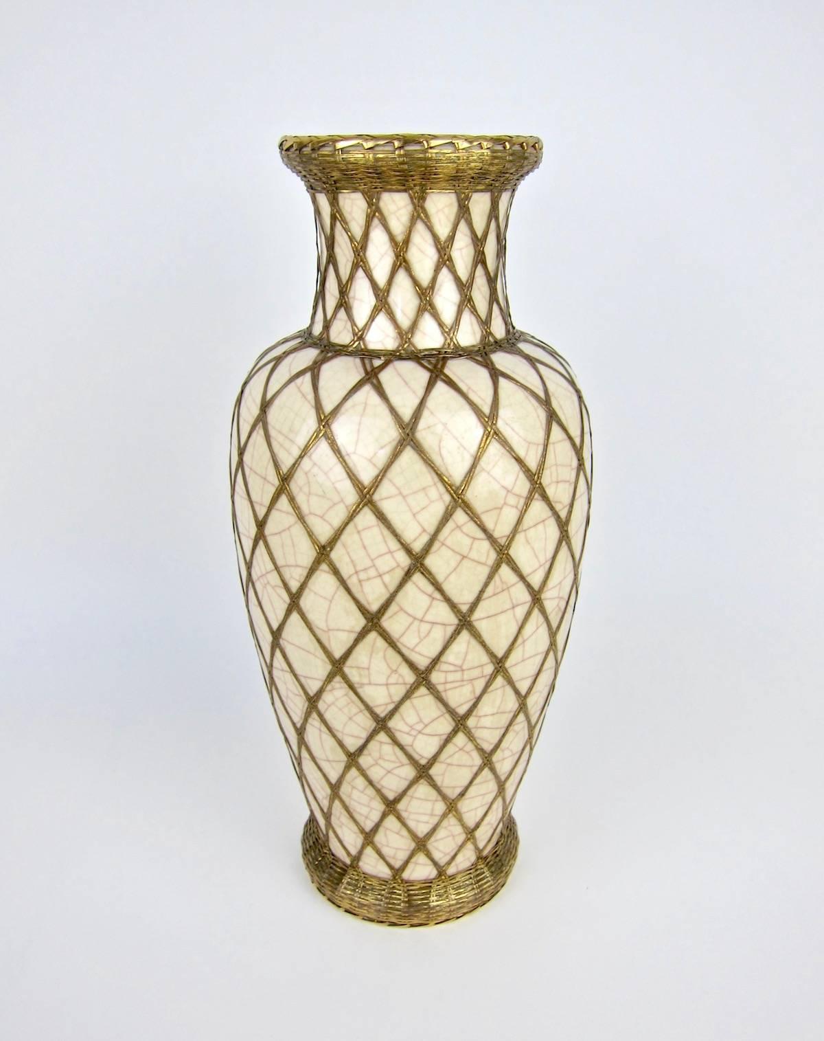 A large glazed art pottery vase, likely from a Japanese Awaji workshop studio, dating to the early 20th century. The vessel is glazed in ivory with an intentional craquelure pattern creating a network of contrasting red lines over the glazed