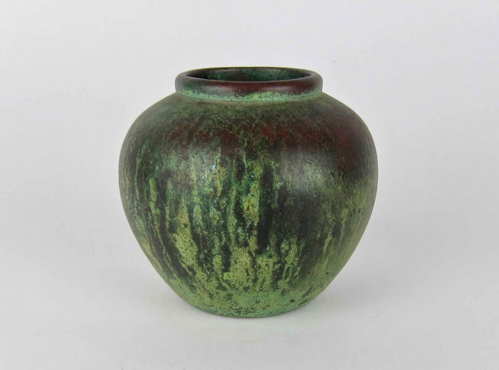 An American Arts & Crafts Clewell metal art vase by Charles Walter Clewell (1876-1965) of canton, Ohio. The vessel has an outer 