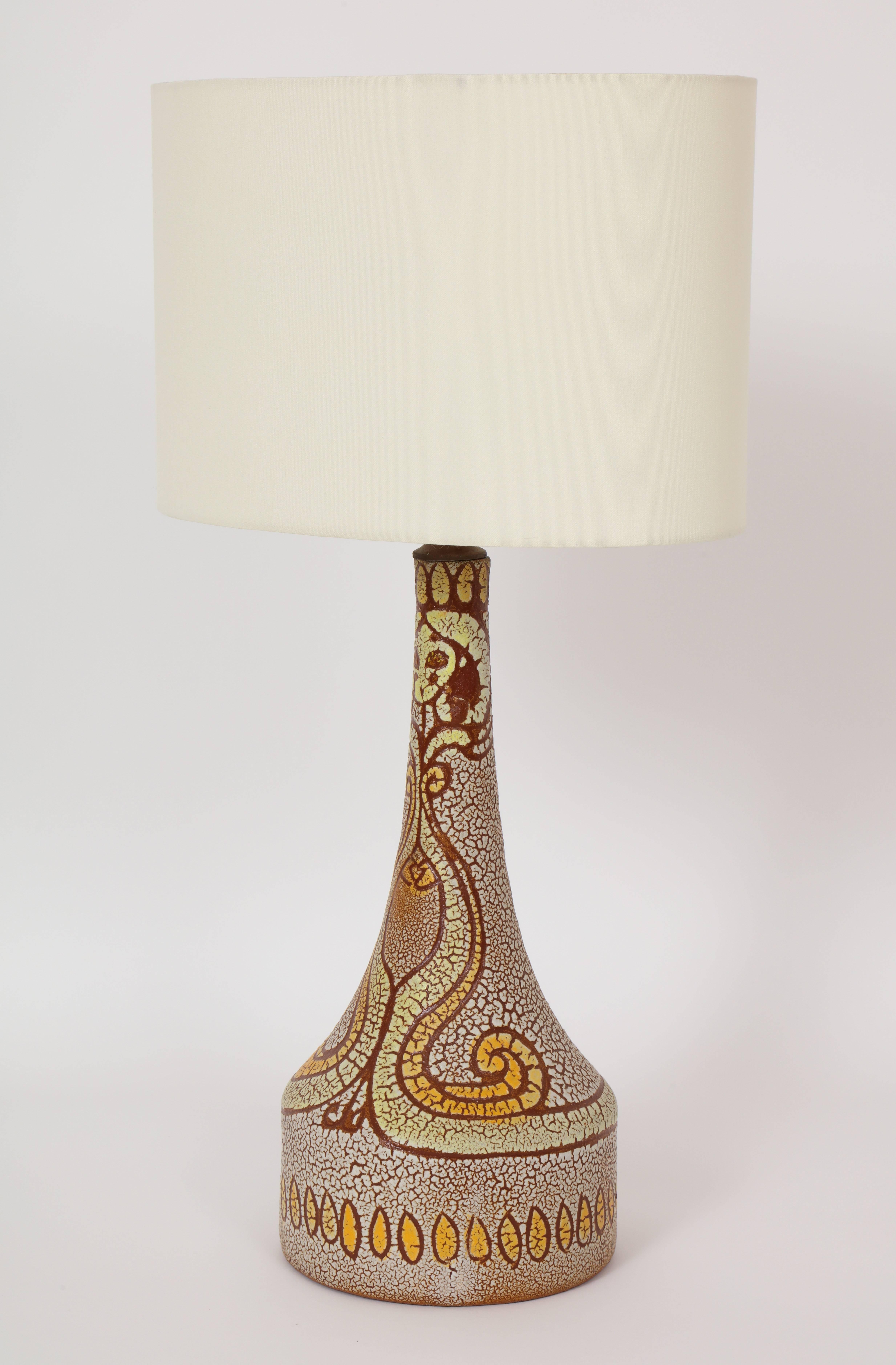 Midcentury accolay attributed yellow, orange, brown ceramic lamp, 1950 France with a face design
Lovely ceramic lamp, circa 1950s.
16 inches to top of pottery,
25.5 inches to top with shade,
7 inches diameter at base,
wired for US.
  
