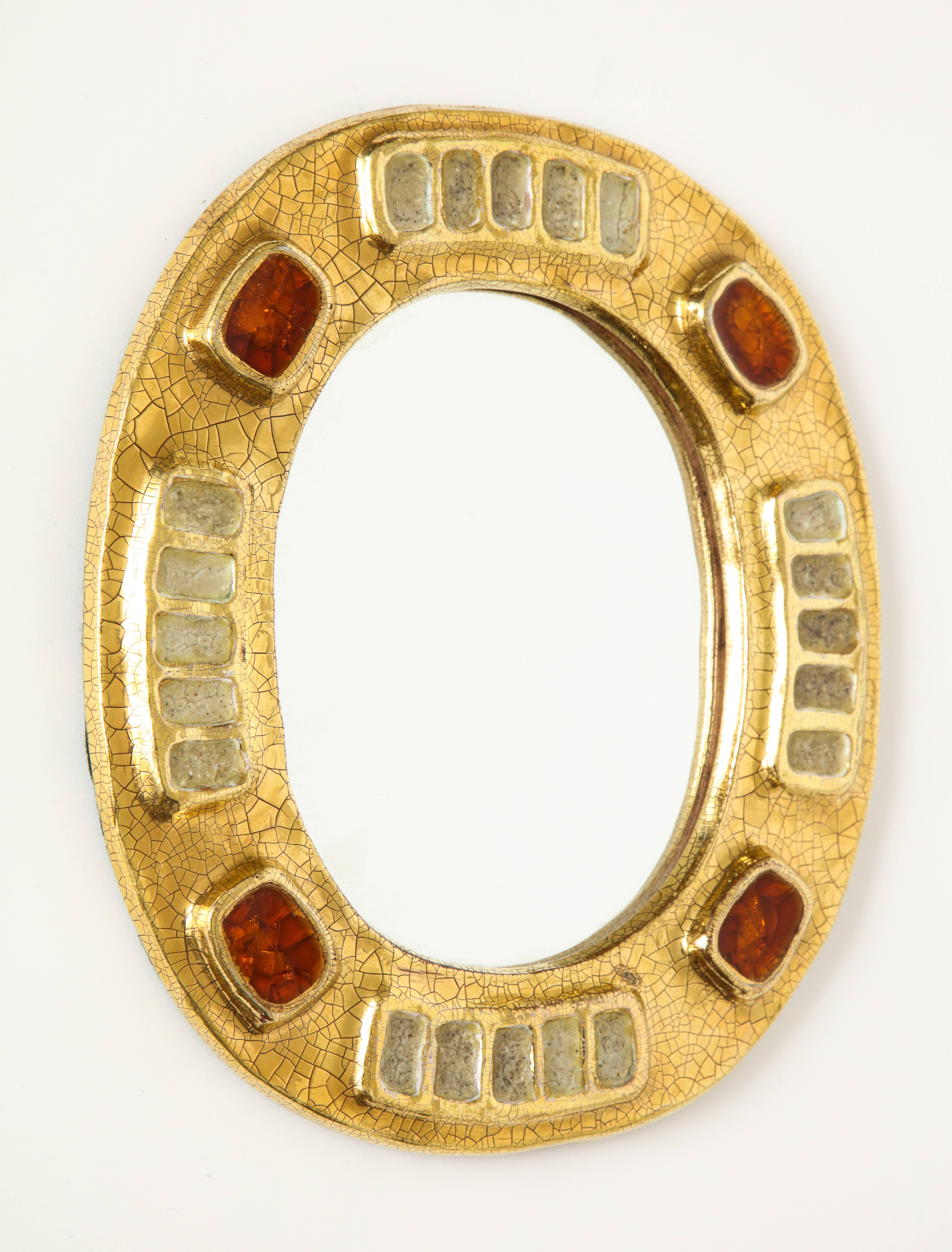Mithé Espelt jewel mirror with gold and dark red enamel, France, 1970s.