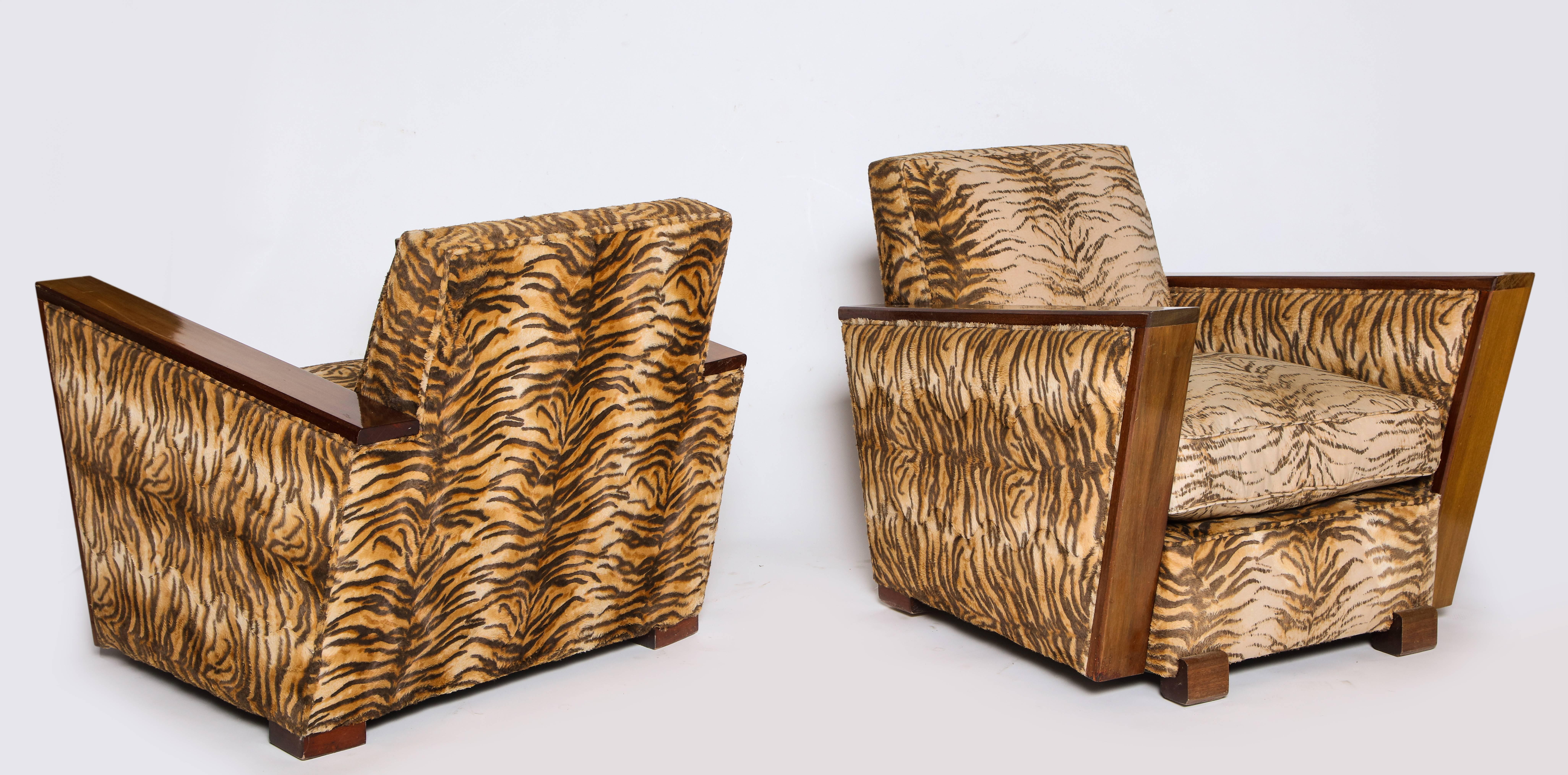 Deco chic animal print pair of chairs, France, 1940s

Chic pair of deco chairs in original lovely vintage condition. Interesting angular arms that create a modern look. The fabric looks to be velvet and worn in perfectly. The wood is walnut.