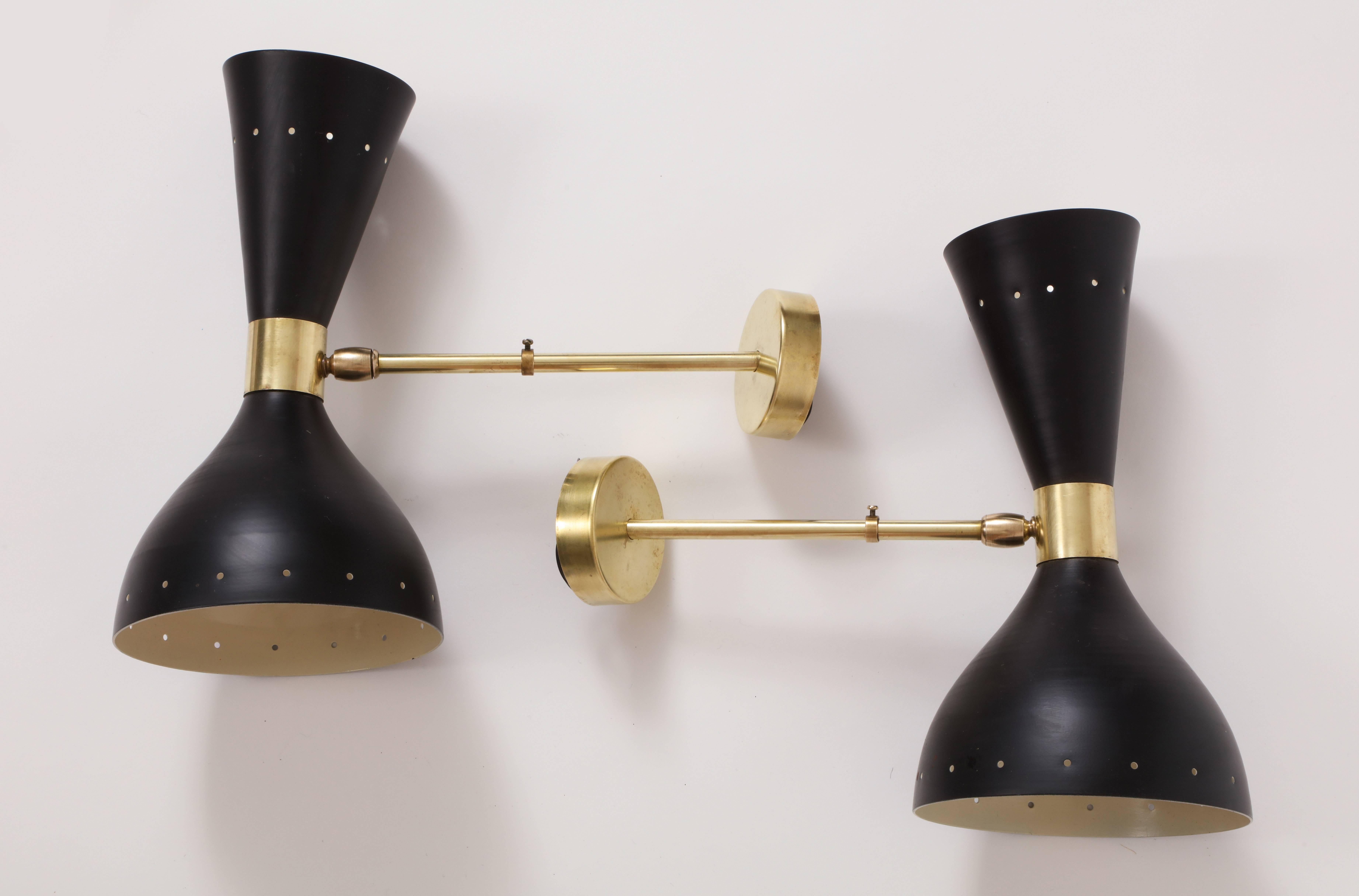 Stilnovo style Diablo brass black Mid-Century Italian wall light sconces, 1950.

Beautiful Stilnovo style black and brass sconces.
Lovely patina on the brass,
In great overall condition.

Height: 11.2.
Deep: 6 inches.
Width: 12 inches.