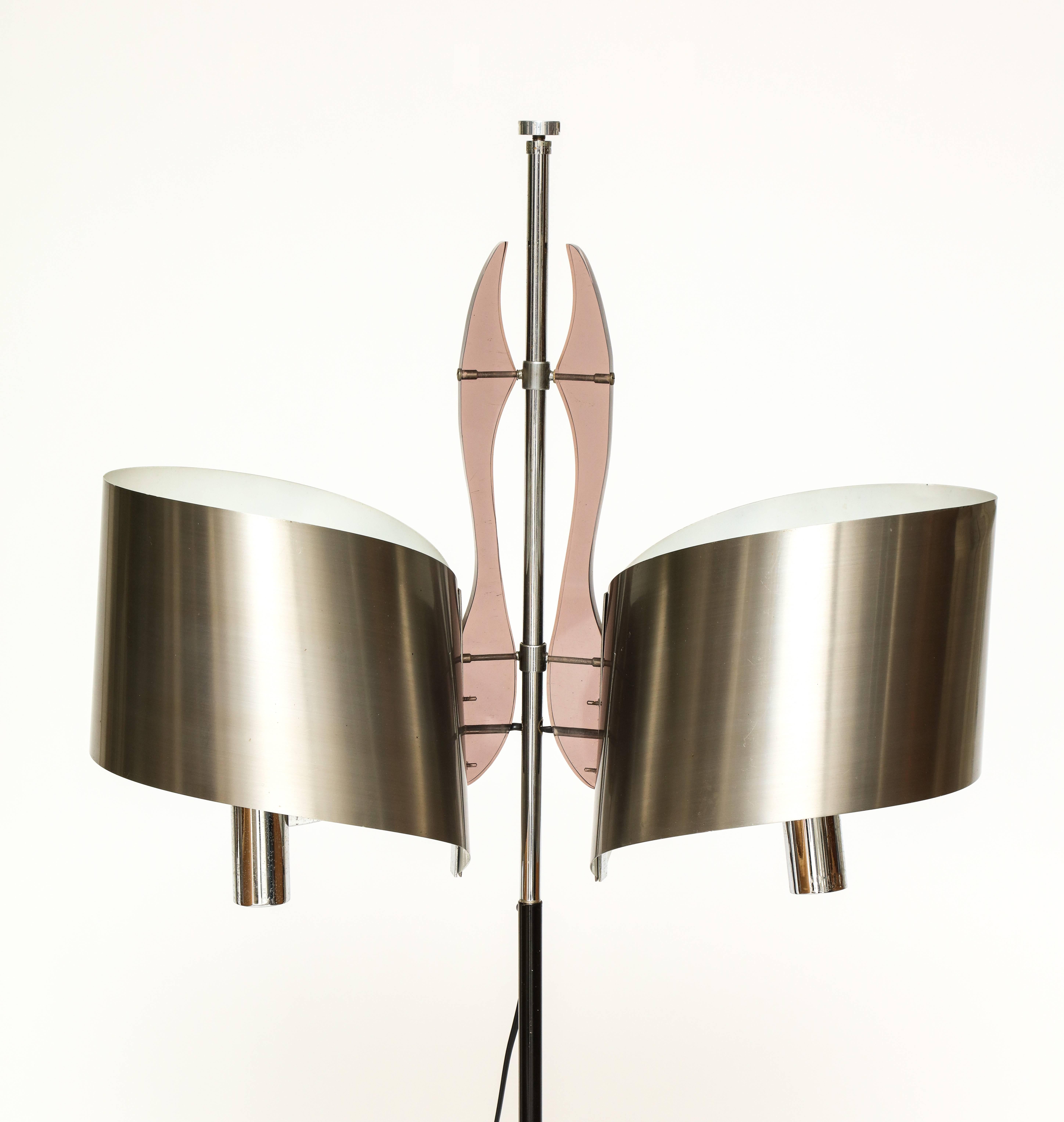 Maison Charles standing floor lamp with stainless steel shade, 1970s, France.

Rare architectural lamp. Heavy bottom base. The shades are connected by Lucite pieces.

Measures: Widest point of top 25 inches,
Length 63 high,
Diameter 11.5.