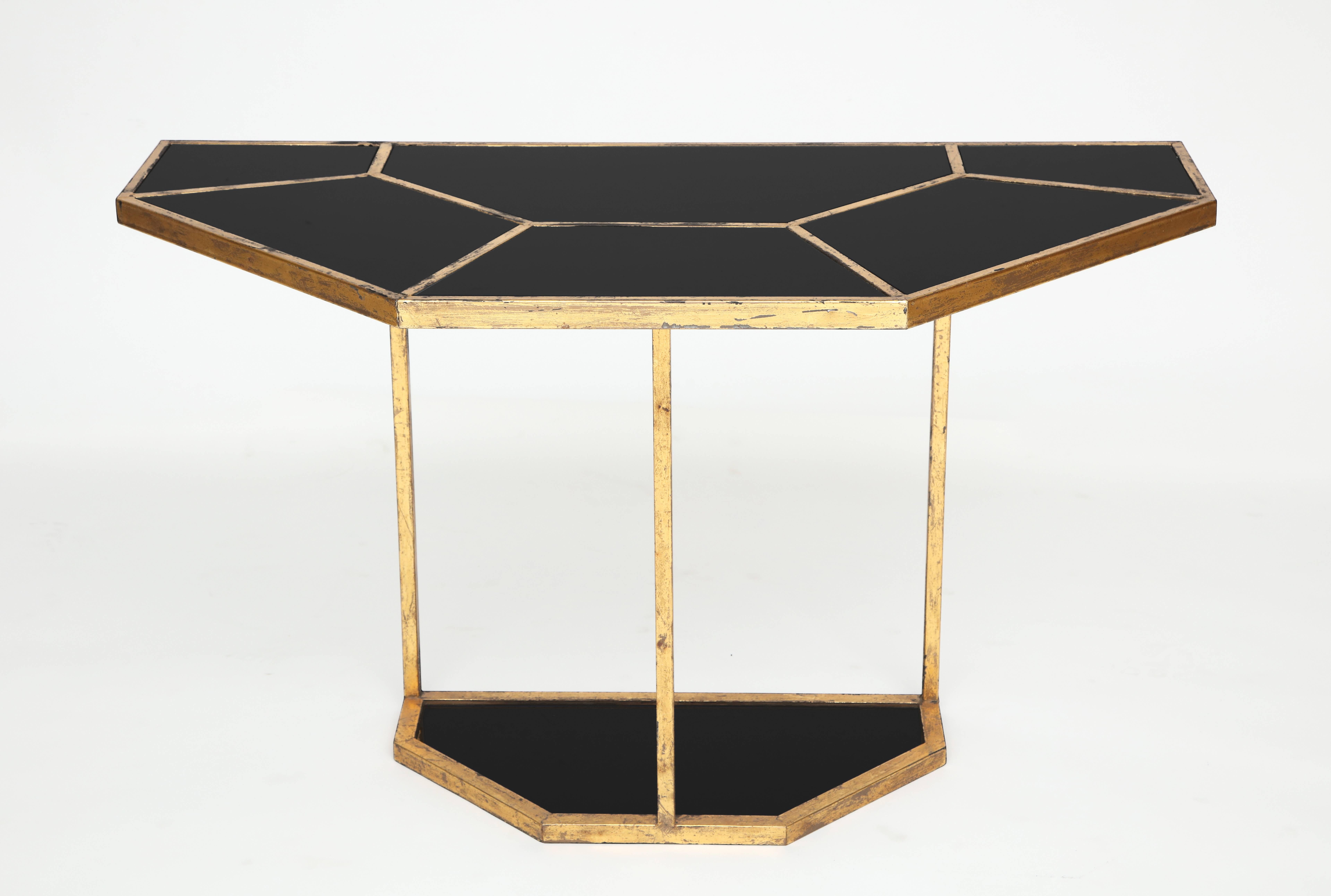 Gabriella Crespi style demilune brass black console, Mid-Century, 1970s-1980s

Gabriella Crespi style console. Similar to the puzzle table. This was probably made sometime in the last 20 years. Lovely patina on the brass and black opanline glass