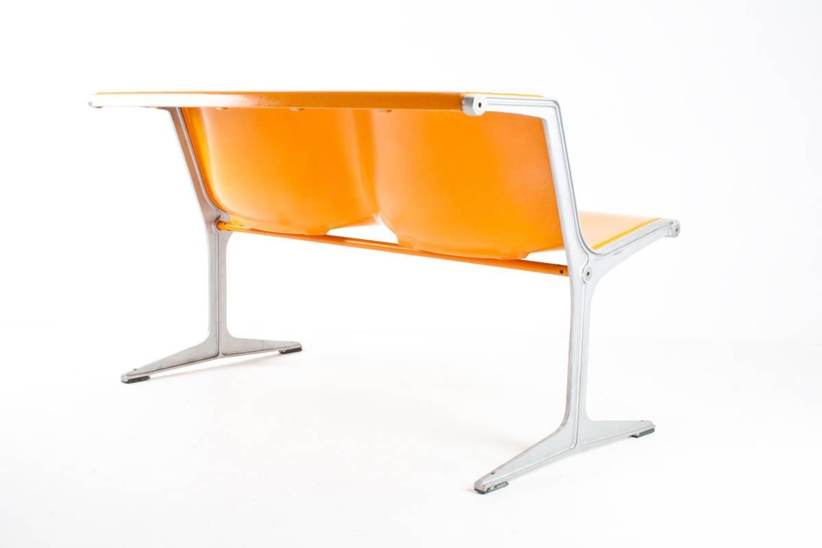 Friso Kramer designed this 1200 series two-seat in 1967 for Wilkhahn Germany, which became one of Wilkhahn’s most successful products for public spaces. This range became especially well known because it was used at the Olympic Games in Munich in