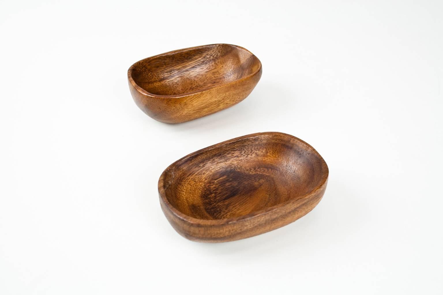 Lovely small teak handmade, sculptured Danish bowls to use for small objects, such as keys, jewelry or as desk accessories. Is sold as set.
