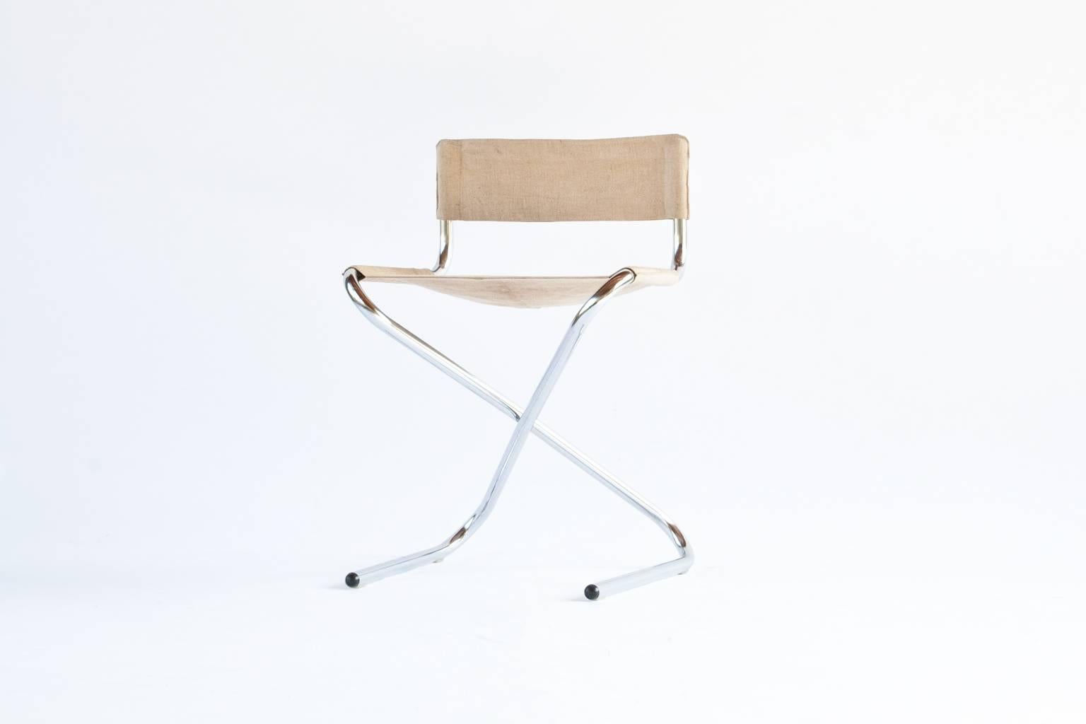 Very unique and rare museum quality piece of Erik Magnussen. Early model Z-chair. This item was produced in 1960s for Torben Orskov. This model was never really in production. Chromed bent tubular frame, folding chair with off white canvas