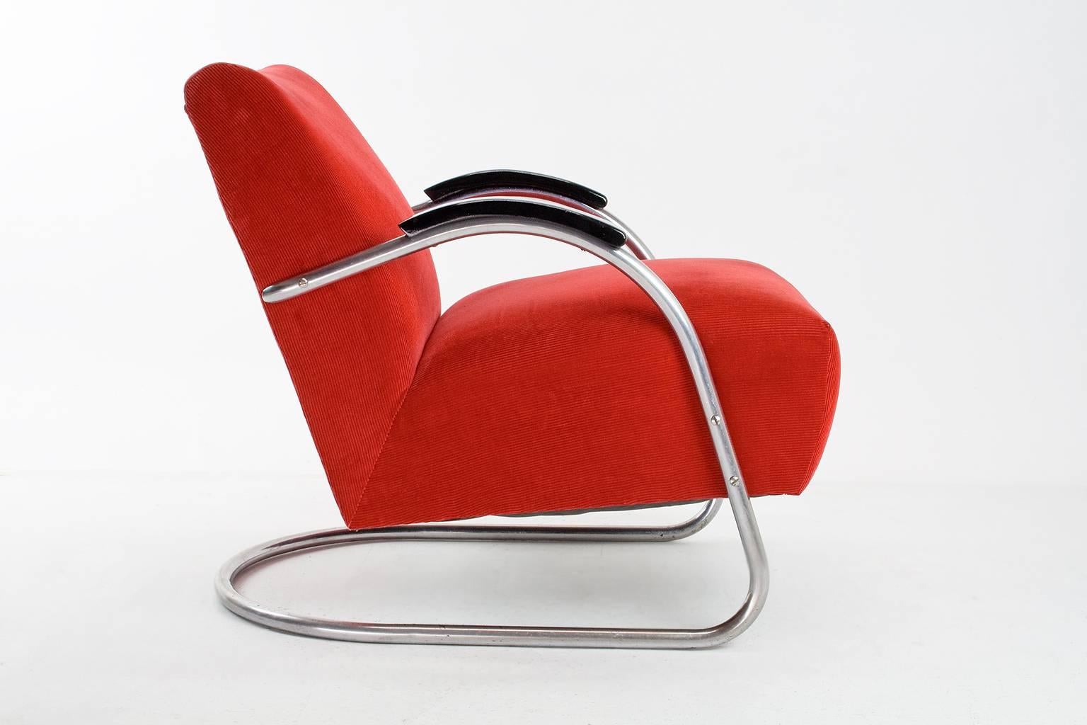 Lovely firemen red Bauhaus armchair of the same period and inspired on the Bauhaus movement. 

This piece is an original 1930s Dutch easy chair by E.M.S. Overschie. The item has been recently new upholstered in a red corduroy fabric, a thick