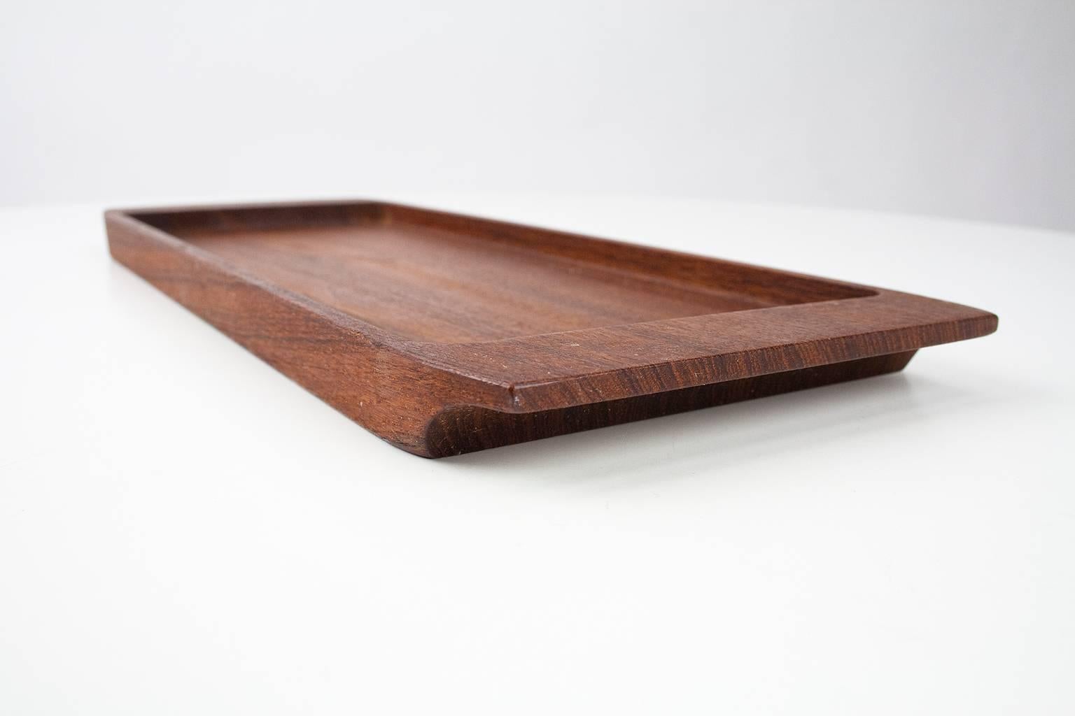 Beautiful Danish 1960s solid teak wooden desk accessory or table tray. To use for pencils, business cards or table and kitchen accessories.

The inner dimensions of the tray are 30.5 cm x 12.5 cm.