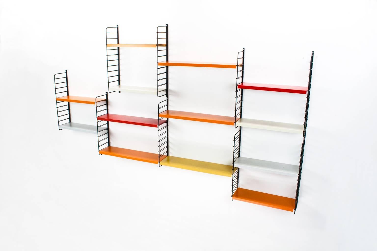 Original bright colored Dutch Mid-Century Modern multicolored modular system of Pilastro designed in the 1960s by Tjerk Reijenga in very good condition. Only some shelves have light patina, but most are in excellent condition.

The design was