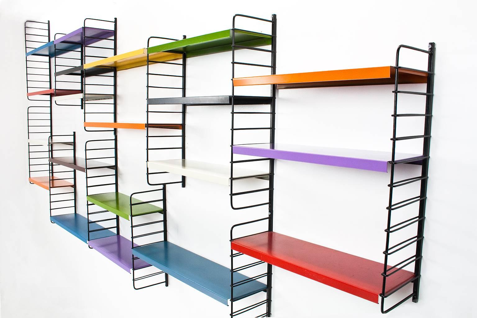 Original Dutch Mid-Century Modern multicolored modular system of Pilastro designed in the 1960s by Tjerk Reijenga in very good condition.

11 black wired uprights in two different heights, 60 and 46.5 cm height and 20 shelves in 2 different widths