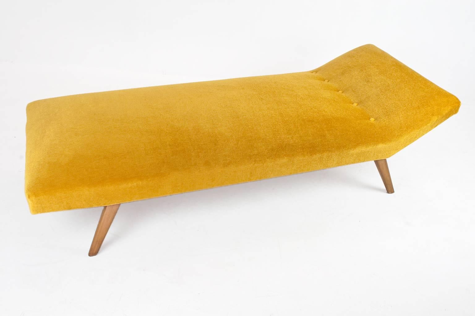 Eye-catching daybed in manner of Theo Ruth for Artifort. The mattress has internal springs, much like a traditional mattress, so it provides exceptional support. Re-upholstered in an excellent golden velvet mohair furniture fabric. Daybed has a