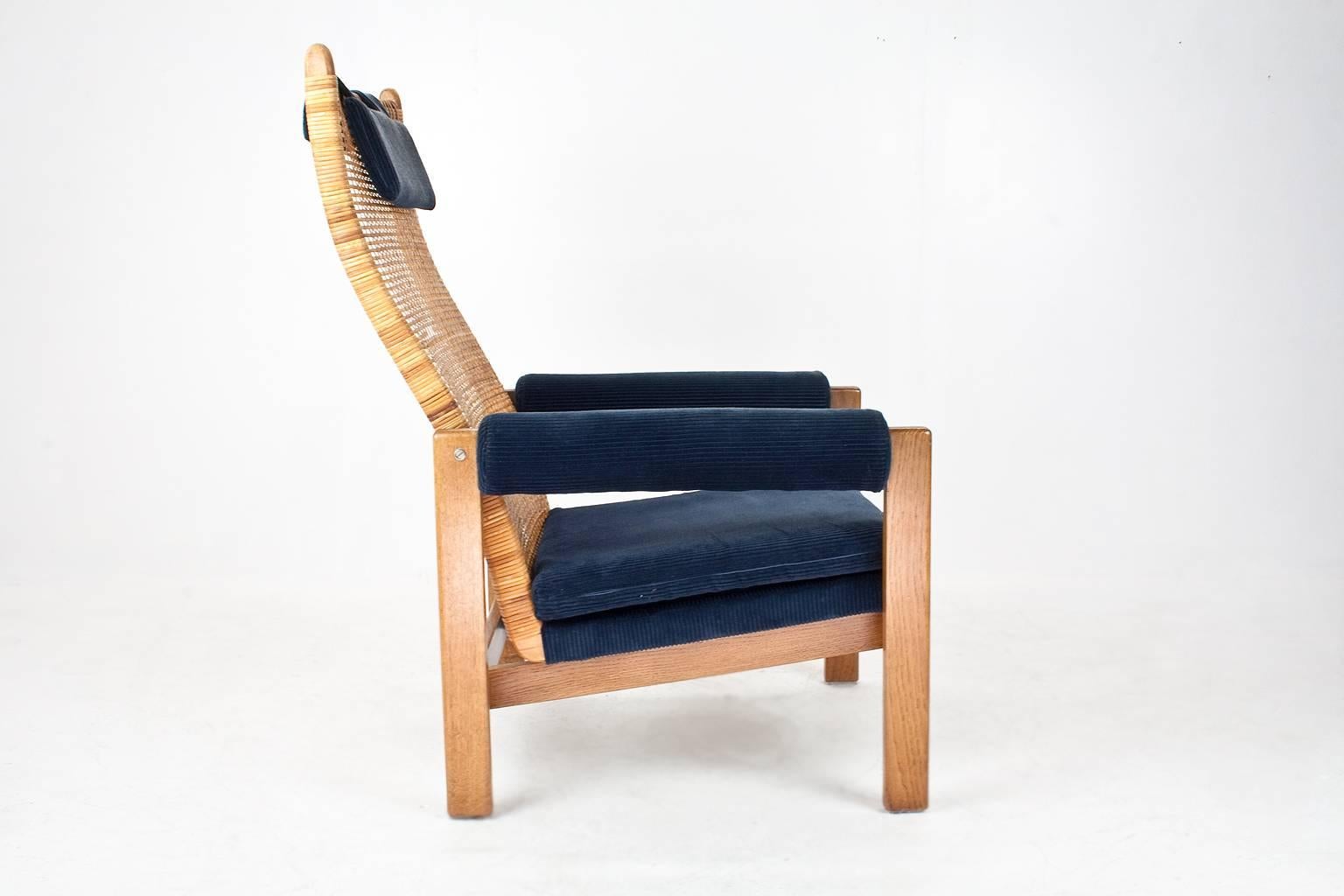 Set of Mid-Century Dutch lounge chairs designed in 1956 for Gebr. Jonkers by P.J. Muntendam, Holland.

Rattan (Peeled pit-rite) backrest, blue upholstered cushions, the webbing straps, wooden armrests and construction are all in very good original