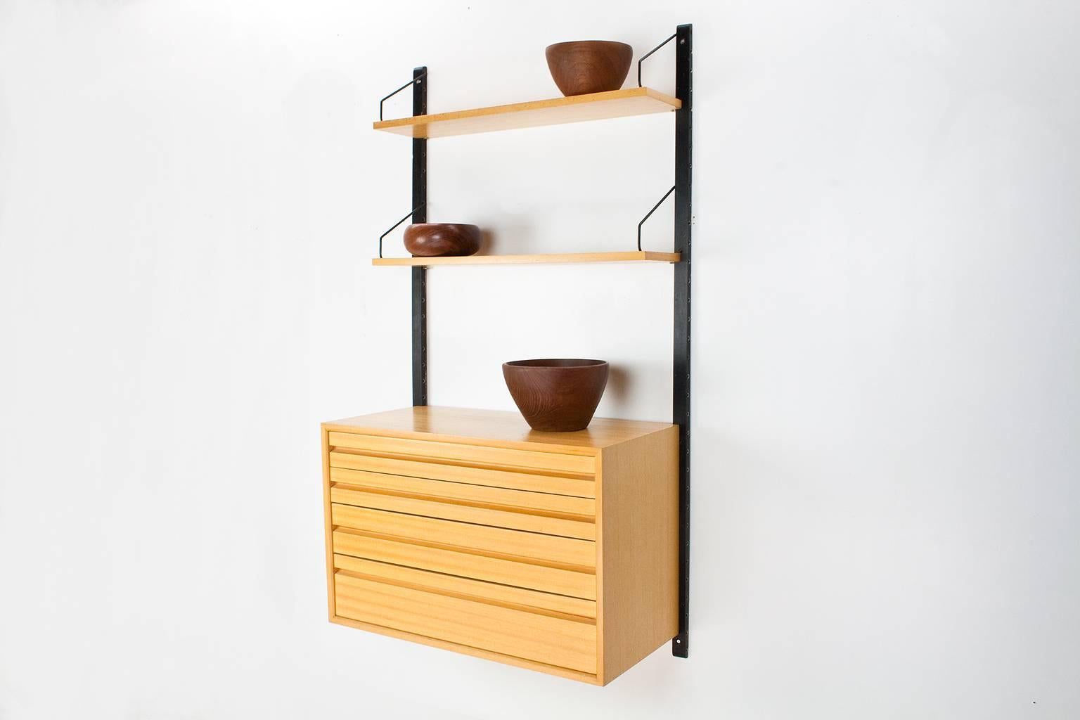 Original Danish wall unit, model Royal, designed by Poul Cadovius in the 1950s for Cado, Denmark. This listed unit was produced by Cado in Denmark in the 1960s. The elements features a lovely quality oak veneer. 

Measure: The unit consists of two