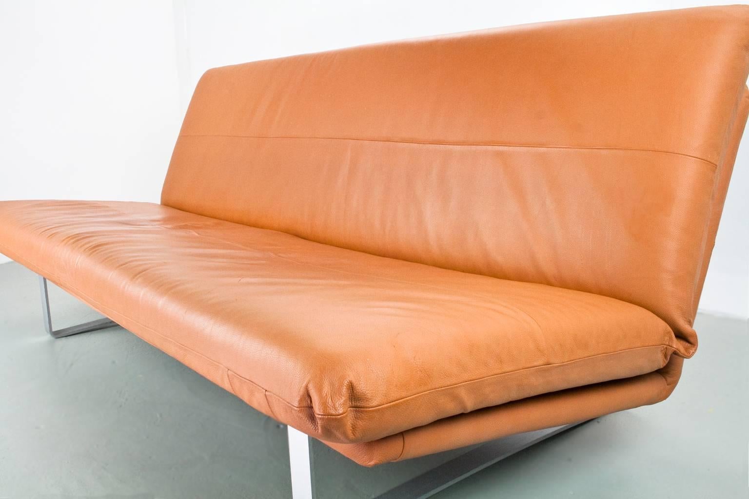 Three-seat sofa, model C683 designed by Kho Liang Ie for Artifort, the Netherlands, 1968. This sofa is re-upholstered in recent years with a cognac colored high quality leather. Grey metal legs.

Ask us about specific shipping costs to your