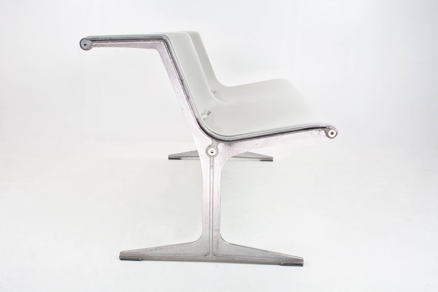 Friso Kramer designed this 1200 series two-seat in 1967 for Wilkhahn Germany, which became one of Wilkhahn’s most iconic products for public spaces. 

The 1200 series is linkable. It has a slender aluminium frame. The benches can be linked together