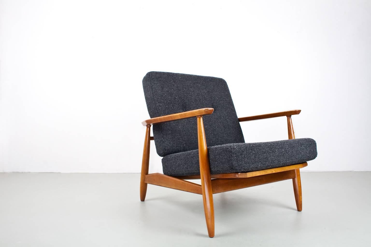 Pair of excellent lounge chairs originated from the 1960s Denmark, in elm and new upholstered in a tactile dark grey furniture fabric (Andes colorcode no.88, 100% woven wool, De Ploeg). Fantastic condition lounge chairs, in the manner of Hans