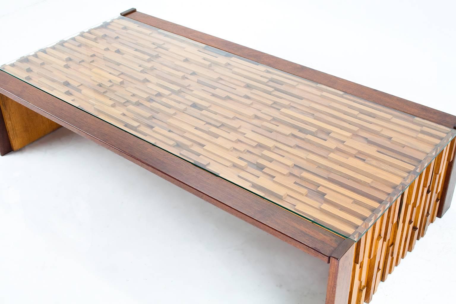 A large (149 x 76.5 cm) Brutalist Jacaranda wooden coffee table by Brazilian designer Percival Lafer, 1960s. A tropical mix of wooden slats. The piece is in very good condition. The glass only has slight traces of use, the table is in very good and