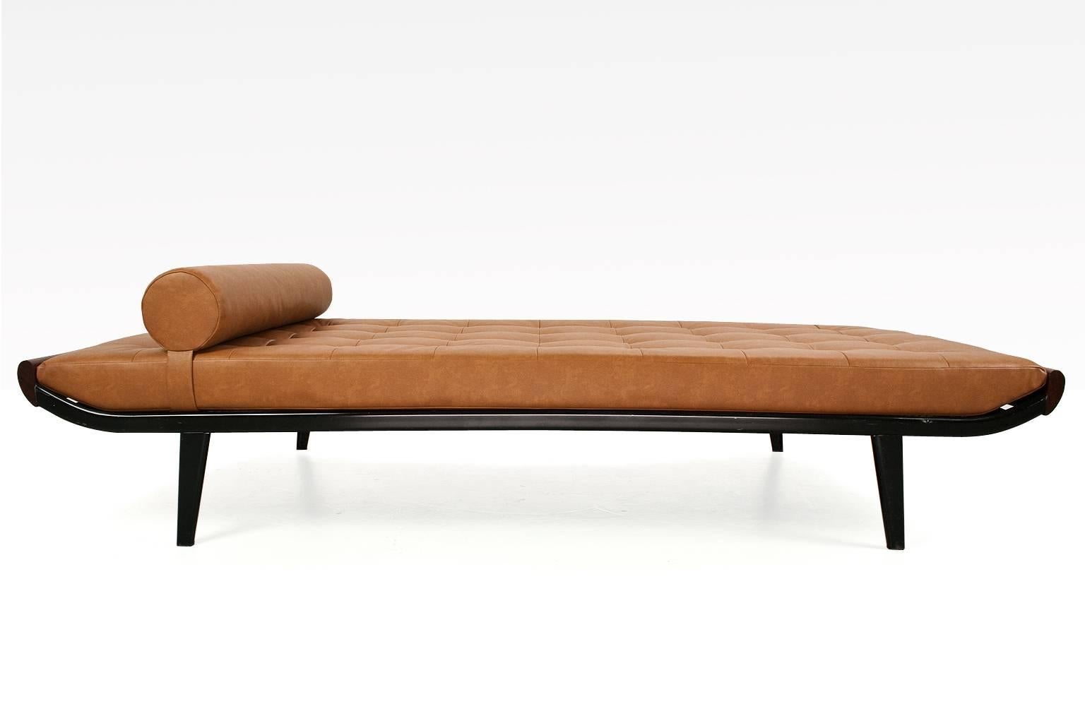Mid-Century Modern Dutch daybed new upholstered in an excellent quality brown or cognac coloured faux leather padded upholstery, on new double layered foam fillings. The springs are in excellent condition. This piece is re-upholstered with