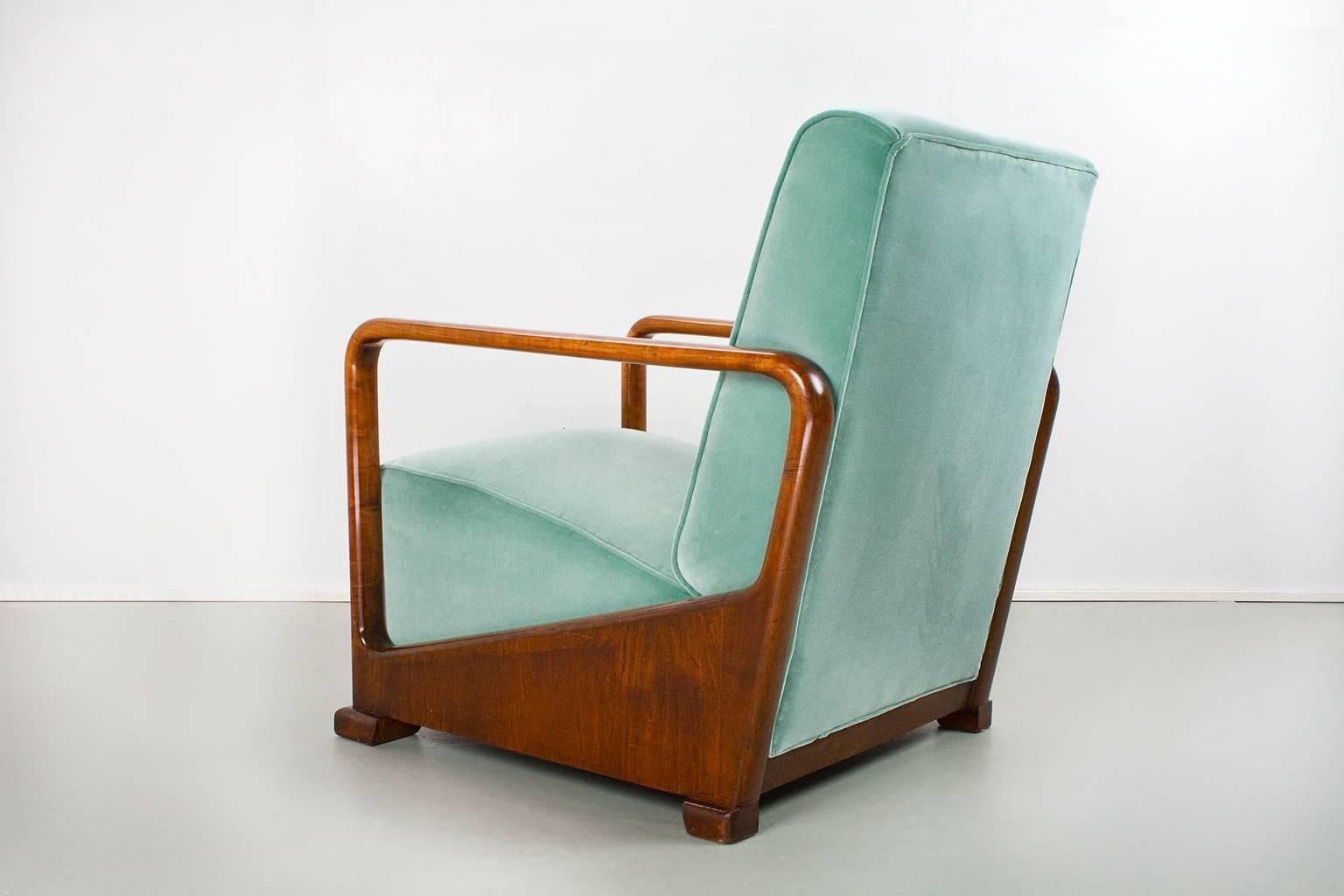 Completely restored and new upholstered Dutch functionalist chair, 1934. This Art Deco piece has a beautiful handmade solid cherry wood frame, which is completely restored and has a new, fresh satin wax coating. The interior of the chair has been