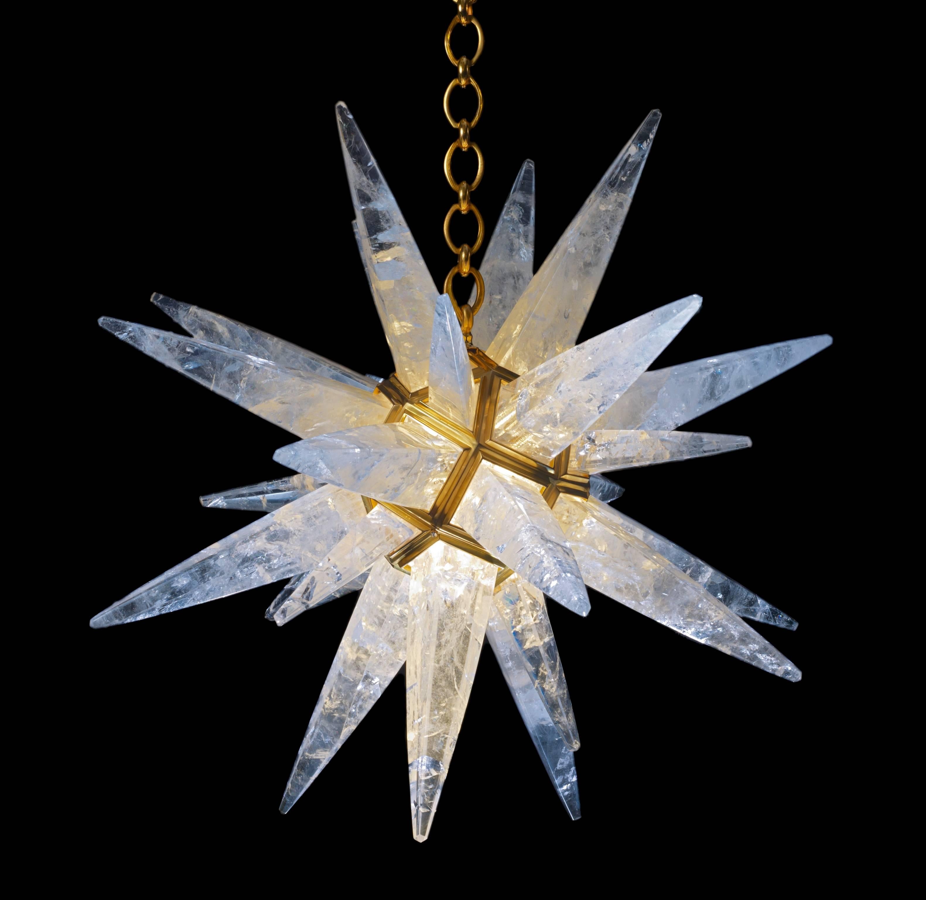 Rock crystal quartz star light gold edition.
Since 2011 Alexandre Vossion was the first who made this model only in rock crystal after an Art Deco model. (Which is made only in glass).
This rock crystal star lighting is made in France.
The fixture,