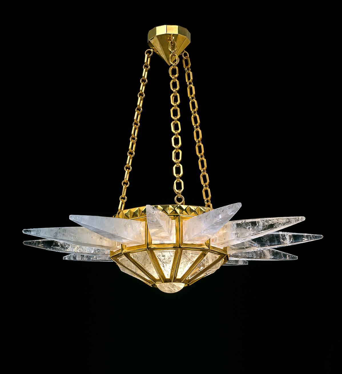 Rock crystal  quartz sunshine light, gold edition. Original model design by Alexandre Vossion and made since 2014. The fixture, chains and canopy of this rock crystal chandelier are handmade in bronze in Paris. Workers who made this model worked