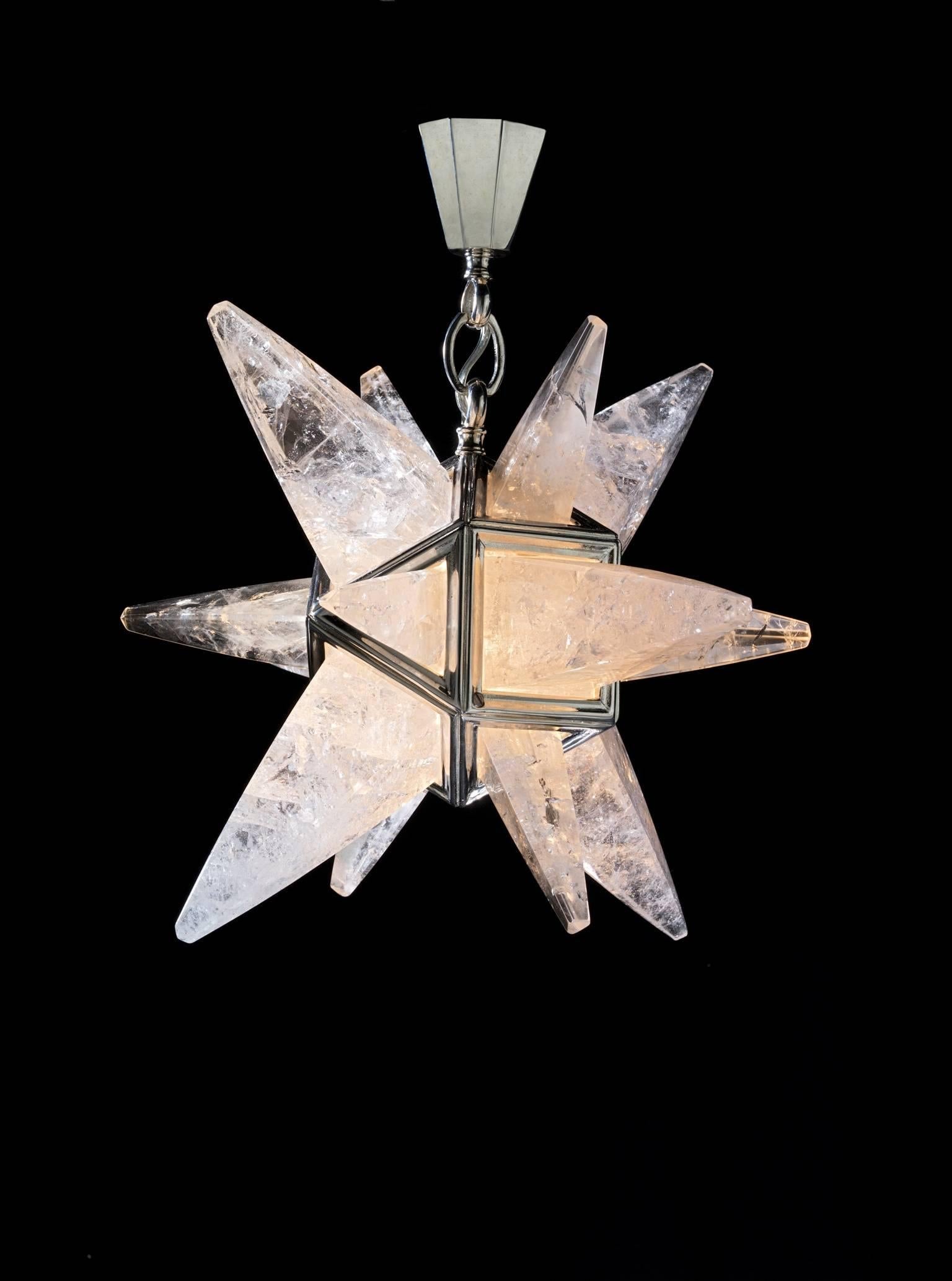 Rock crystal star light II silver edition. Model design by Alexandre Vossion. This rock crystal star quartz lighting is made in France. The fixture, the chain and the canopy of this rock crystal lighting are handmade in bronze. Each workers who
