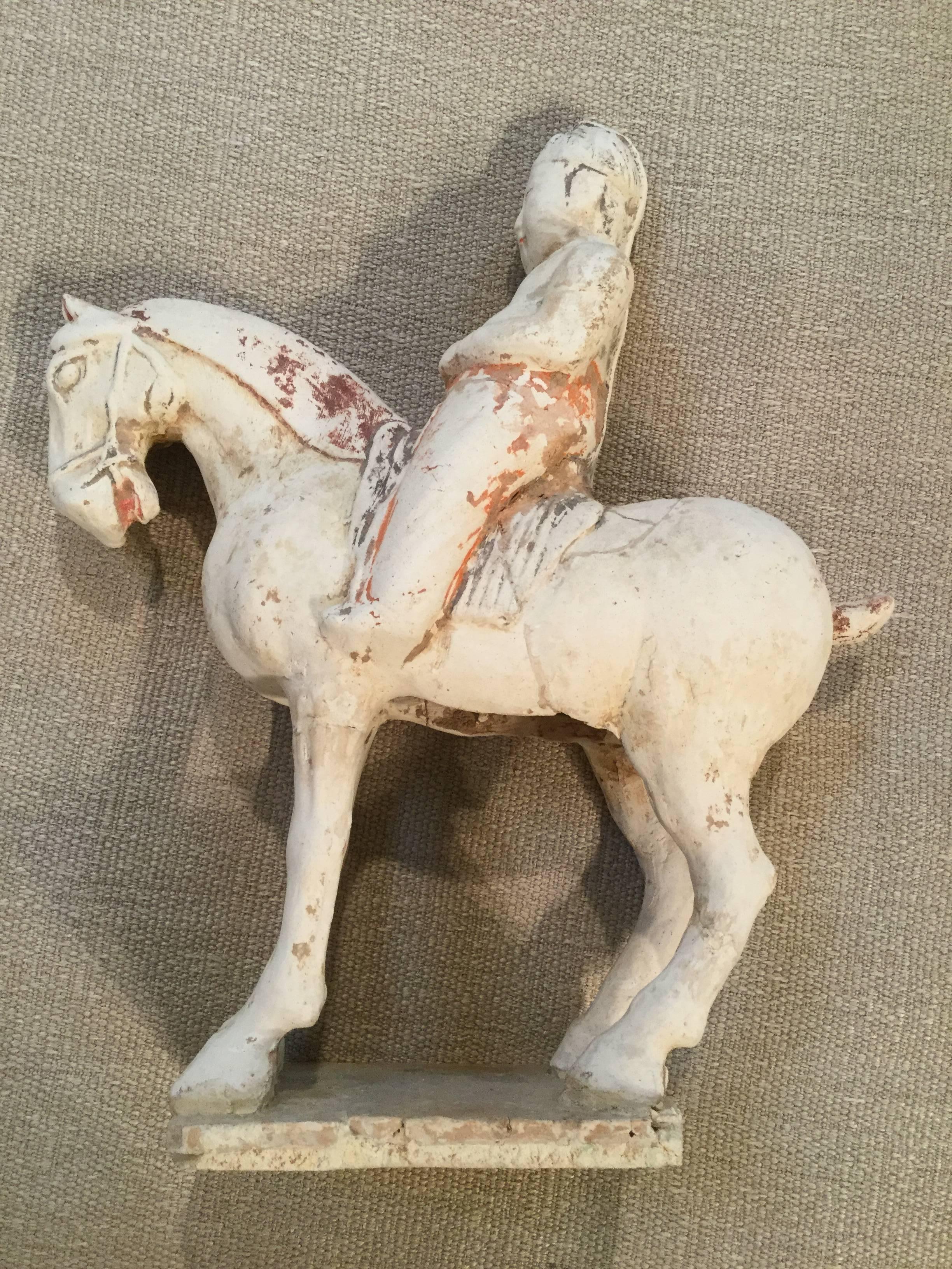 Made during the Sui Dynasty (581~618) pottery burial horse's age has been certificated by Oxford Authentication, Ltd. It is 14” high, 12” wide and 4” deep. It has repairs which appear to be very old. A custom-made stand is included.